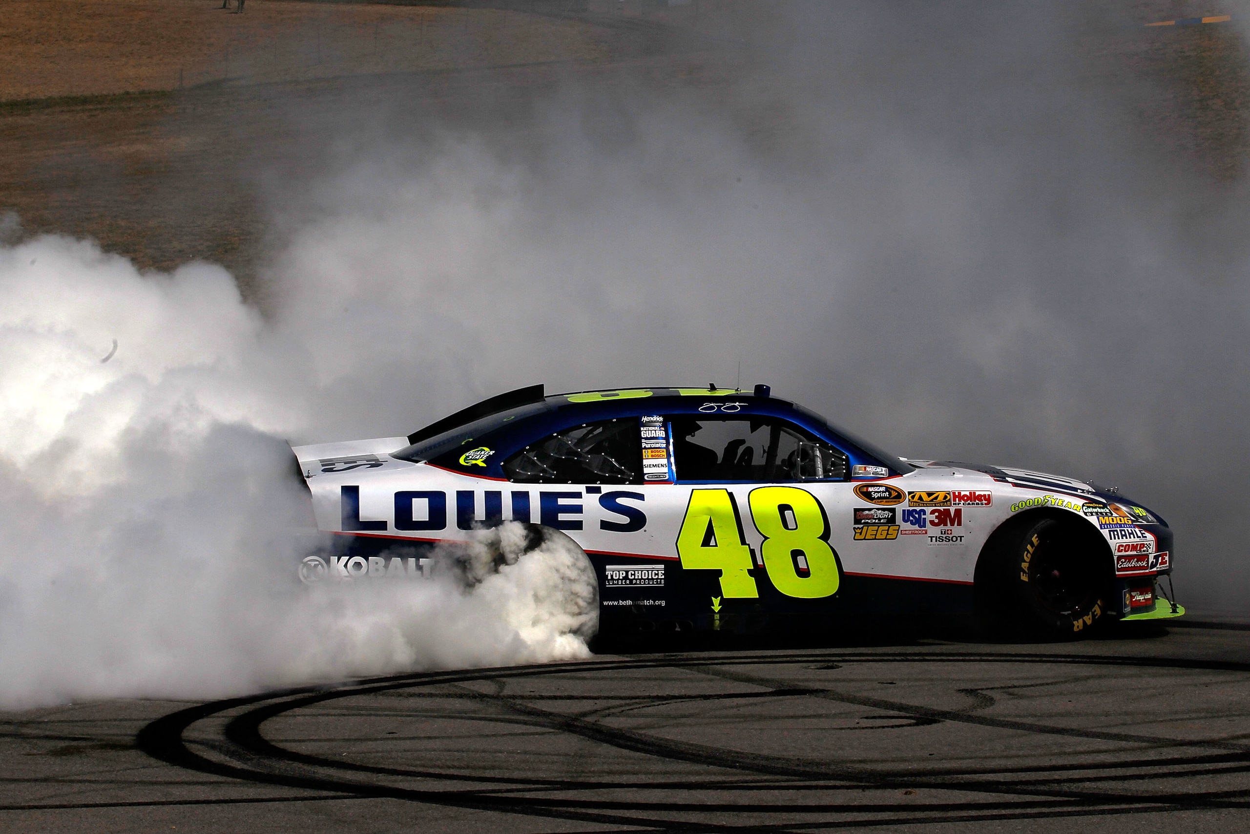 SONOMA, CA - JUNE 20:  Jimmie Johnson, driver of the #48 Lowe's Chevrolet, performs a burnout after winning the NASCAR Sprint Cup Series Toyota/Save Mart 350 at Infineon Raceway on June 20, 2010 in Sonoma, California.  (Photo by Todd Warshaw/Getty Images)