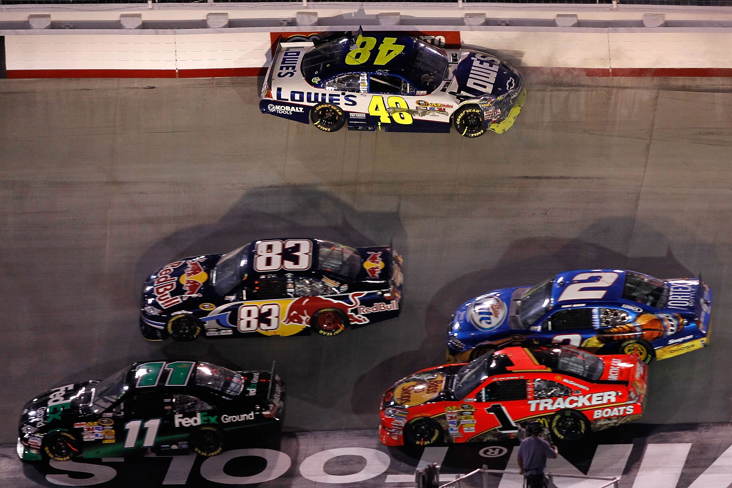 BRISTOL, TN - AUGUST 21:  Jimmie Johnson, driver of the #48 Lowe's Chevrolet, hits the wall in turn 1 during the NASCAR Sprint Cup Series IRWIN Tools Night Race at Bristol Motor Speedway on August 21, 2010 in Bristol, Tennessee.  (Photo by Todd Warshaw/Ge