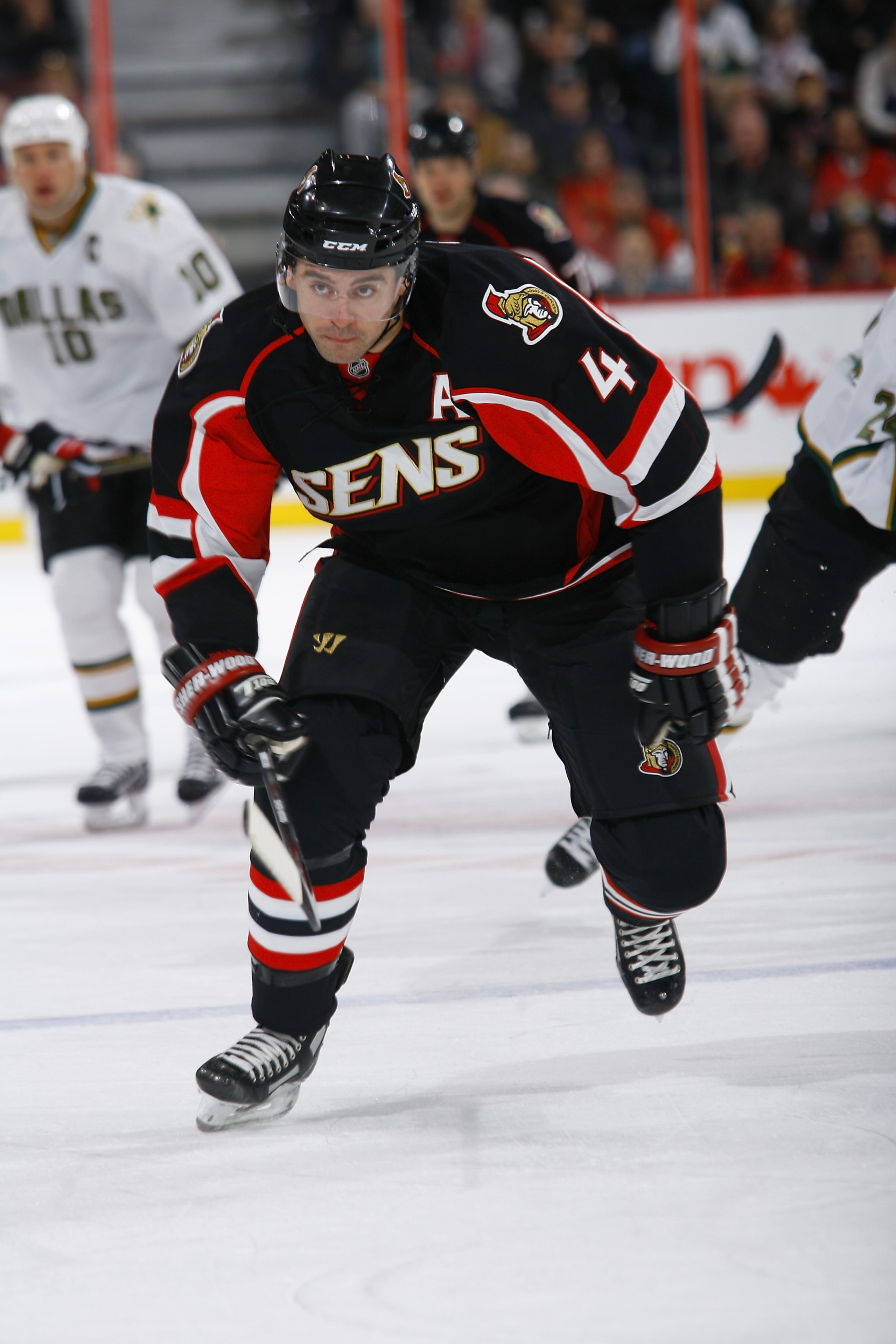 OTTAWA, ON - NOVEMBER 24: Chris Phillips #4 of the Ottawa Senators skates hard into his zone in a game against the Dallas Stars at Scotiabank Place on November 24, 2010 in Ottawa, Ontario, Canada. (Photo by Phillip MacCallum/Getty Images)