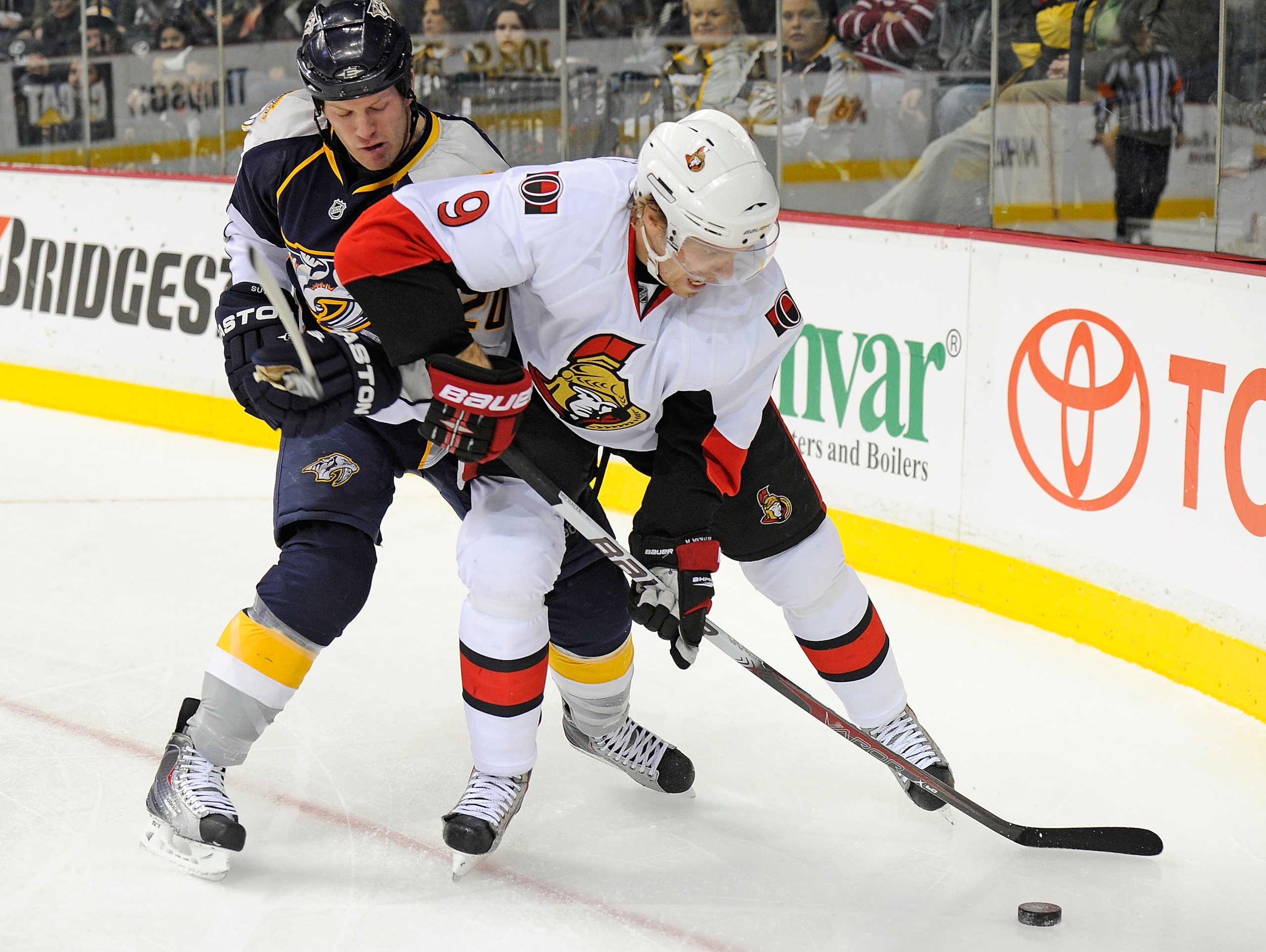 NASHVILLE, TN - DECEMBER 23:  Ryan Suter #20 of the Nashville Predators ties up Milan Michalek #9 of the Ottawa Senators on December 23, 2010 at the Bridgestone Arena in Nashville, Tennessee.  (Photo by Frederick Breedon/Getty Images)