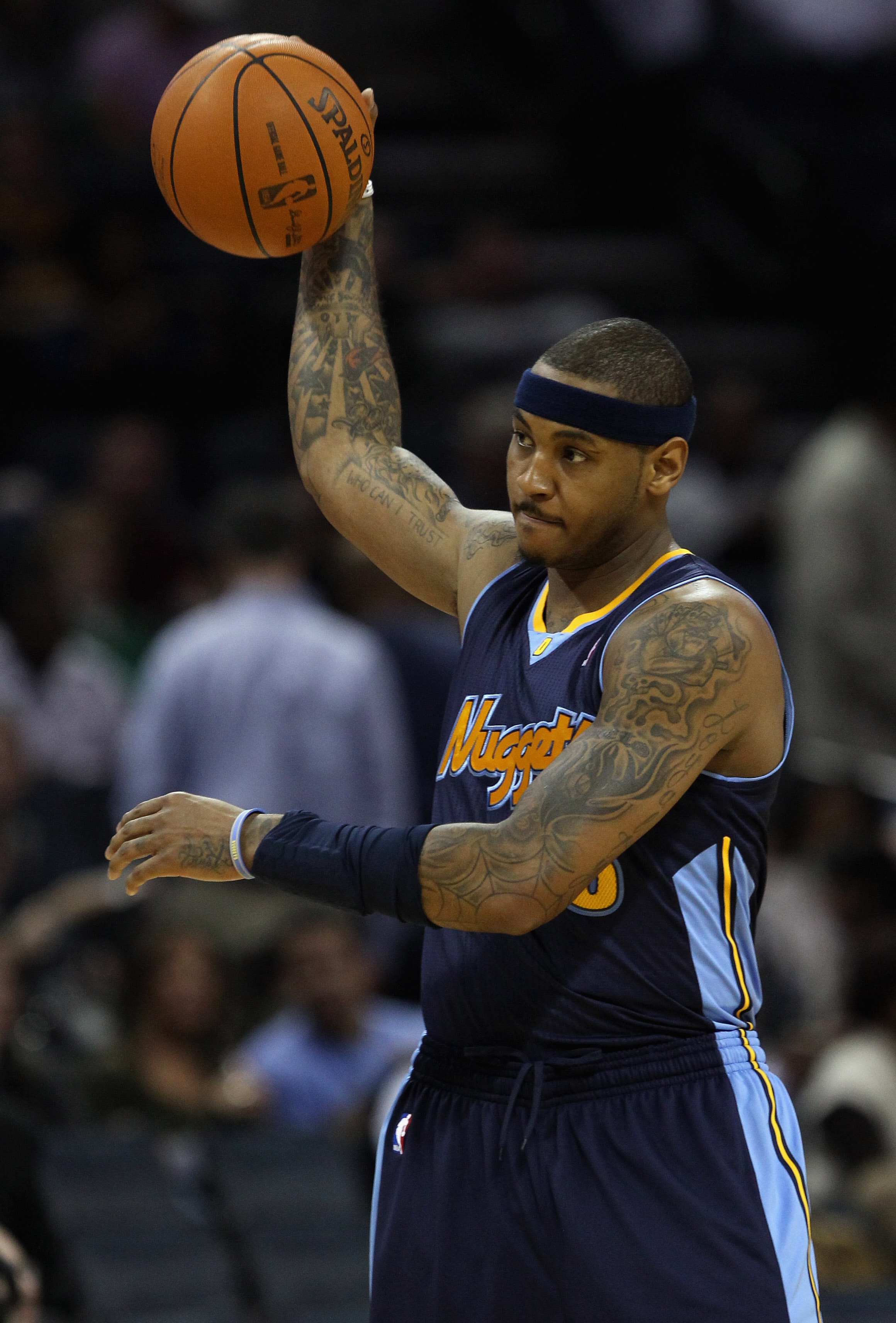 CHARLOTTE, NC - DECEMBER 07:  Carmelo Anthony #15 of the Denver Nuggets watches on against the Charlotte Bobcats during their game at Time Warner Cable Arena on December 7, 2010 in Charlotte, North Carolina.  NOTE TO USER: User expressly acknowledges and