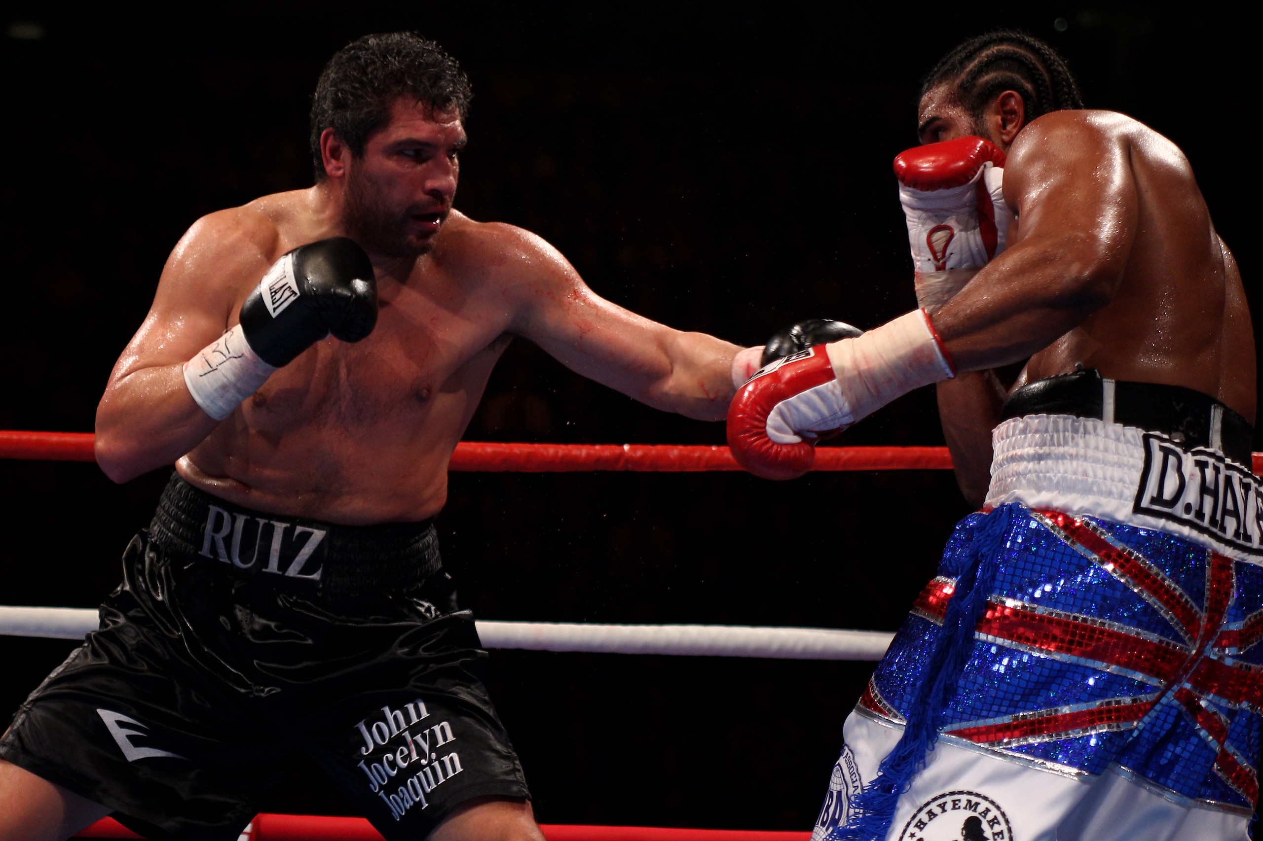 MANCHESTER, ENGLAND - APRIL 03:  John Ruiz (l) of USA hits out at David Haye (r) of England during the World Heavyweight Bout at the MEN Arena on April 3, 2010 in Manchester, England.  (Photo by Michael Steele/Getty Images)