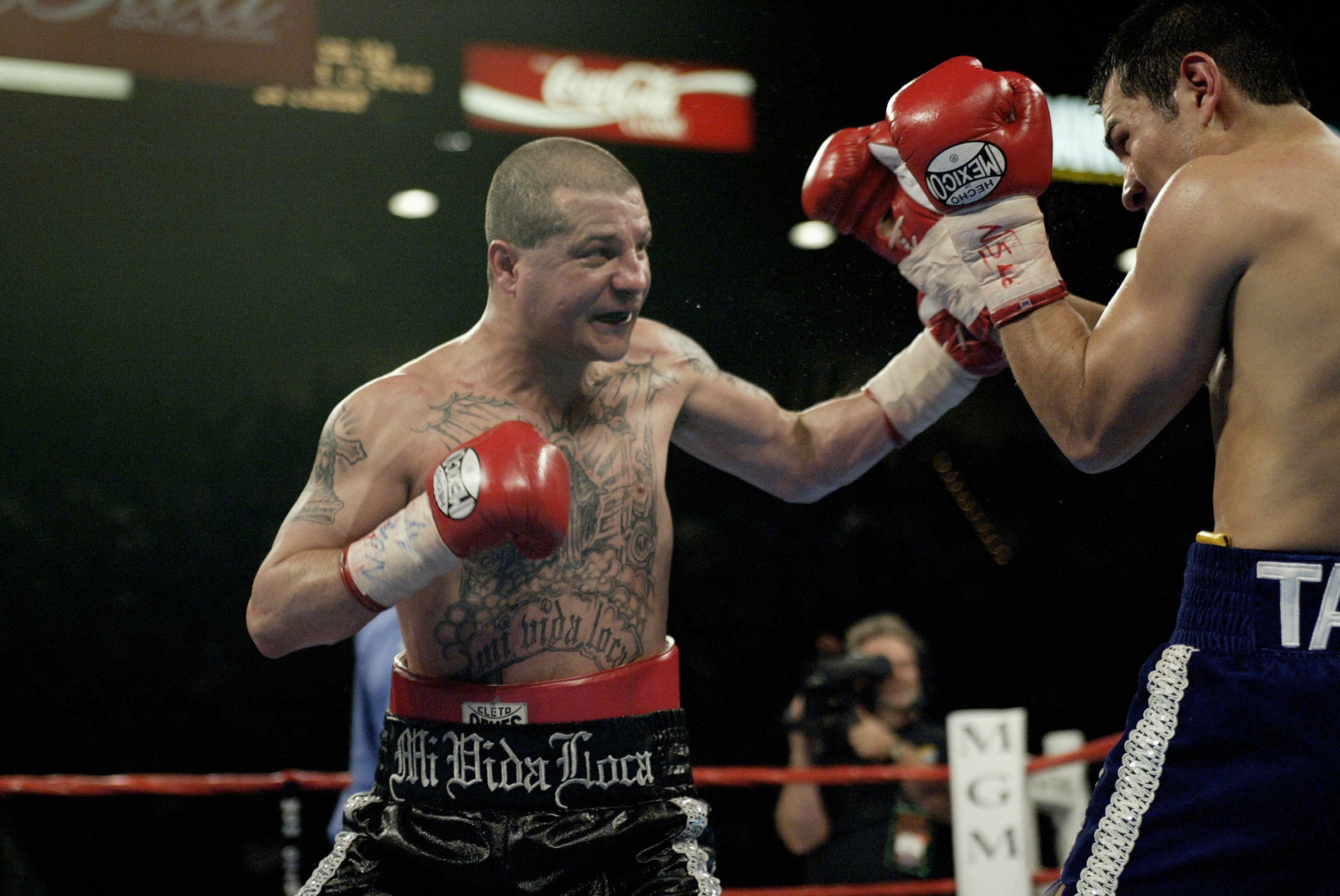 LAS VEGAS, NV - NOVEMBER 2:   Johnny Tapia defends himself against during the featherweight championship fight at the MGM Grand Garden Arena on November 2, 2002 in Las Vegas, Nevada.  (Photo by Jed Jacobsohn/Getty Images)