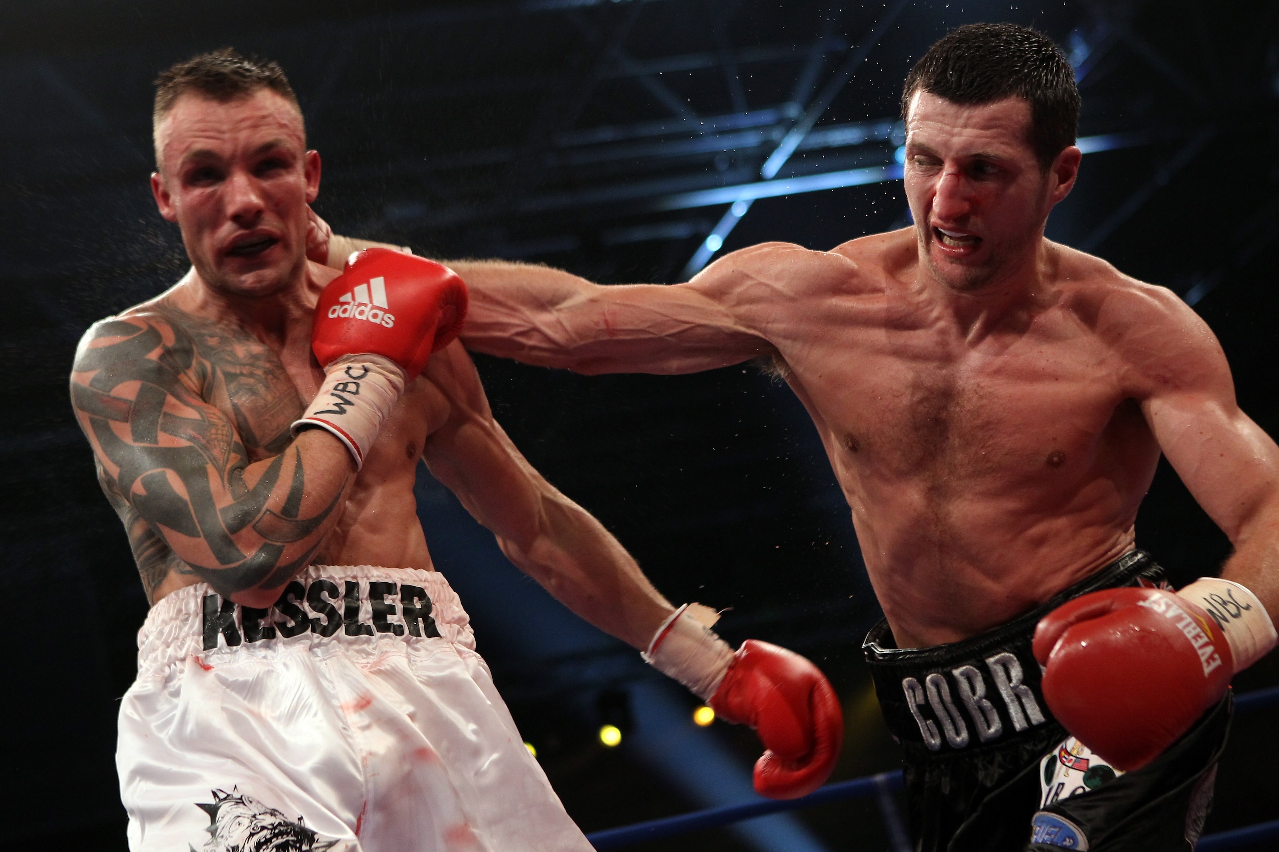 HERNING, DENMARK - APRIL 24:  Carl Froch of England (R) connects with a right against Mikkel Kessler of Denmark during their Super Six WBC Super Middleweight title fight on April 24, 2010 at MCH  Messecenter Arena in Herning, Denmark.  (Photo by John Gich