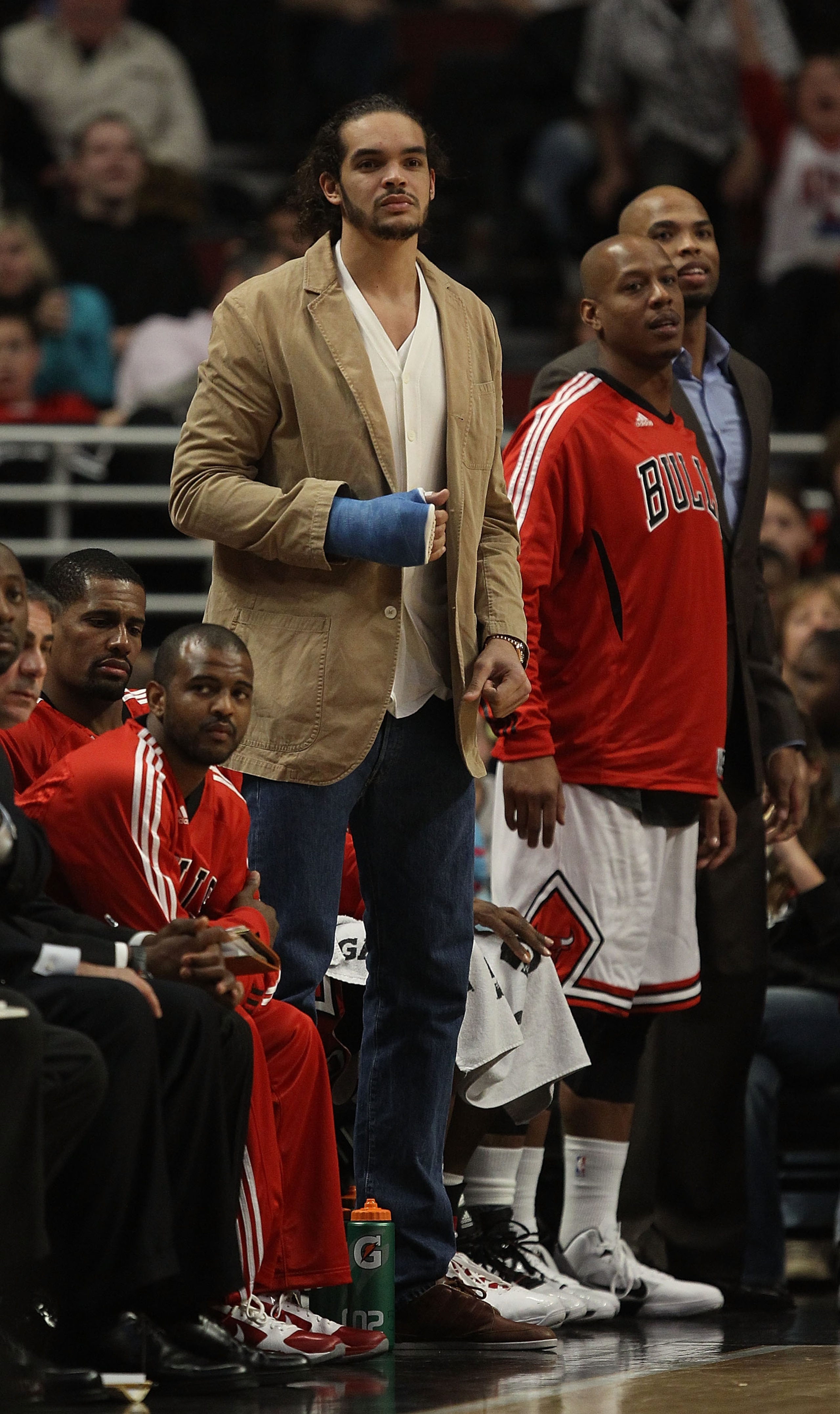 CHICAGO, IL - DECEMBER 21: Injured player Joakim Noah of the Chicago Bulls watches as his teammates take on the Philadelphia 76ers at the United Center on December 21, 2010 in Chicago, Illinois. The Bulls defeated the 76ers 121-76. NOTE TO USER: User expr