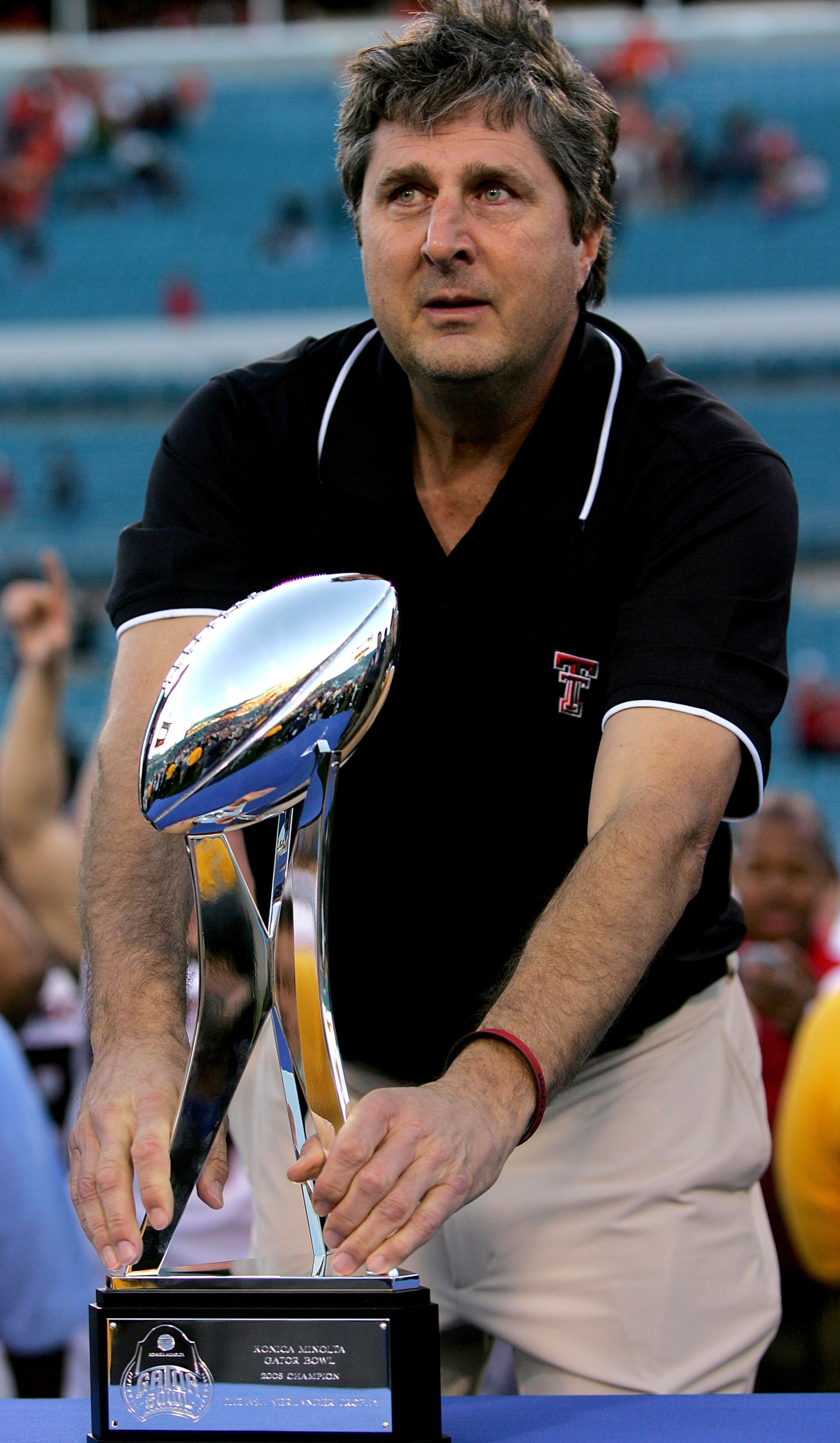 JACKSONVILLE, FL - JANUARY 01: Coach Mike Leach of the Texas Tech Red Raiders holds the trophy following Gator Bowl against the Virginia Cavaliers at Jacksonville Municipal Stadium on January 1, 2008 in Jacksonville, Florida. (Photo by Sam Greenwood/Get JACKSONVILLE, FL - JANUARY 01: Coach Mike Leach of the Texas Tech Red Raiders holds the trophy following Gator Bowl against the Virginia Cavaliers at Jacksonville Municipal Stadium on January 1, 2008 in Jacksonville, Florida. (Photo by Sam Greenwood/Get