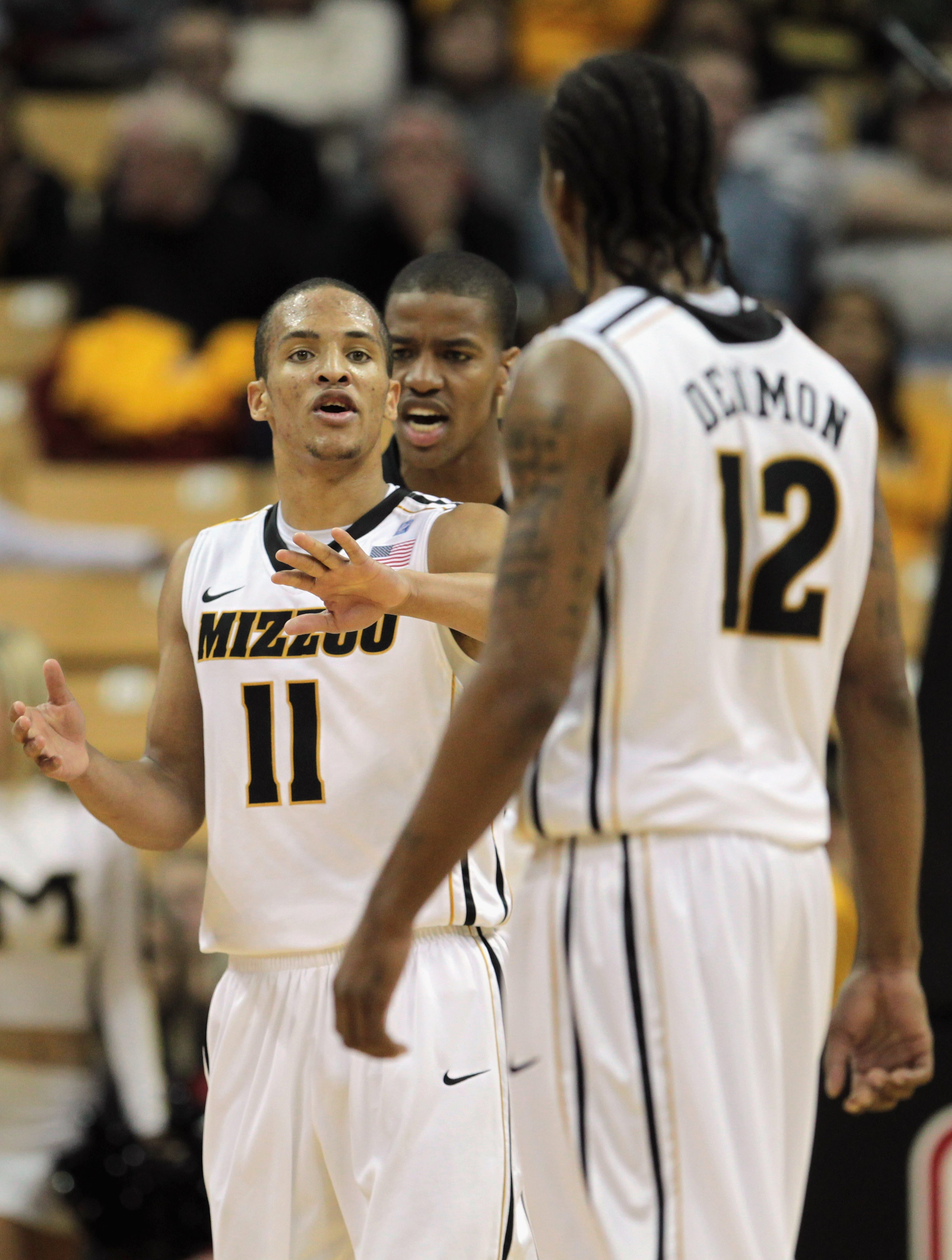 COLUMBIA, MO - DECEMBER 08:  Michael Dixon #11 #10 of the Missouri Tigers congratulates Marcus Denmon #12 after scoring during the game against of the Vanderbilt Commodores on December 8, 2010 at Mizzou Arena in Columbia, Missouri.  (Photo by Jamie Squire