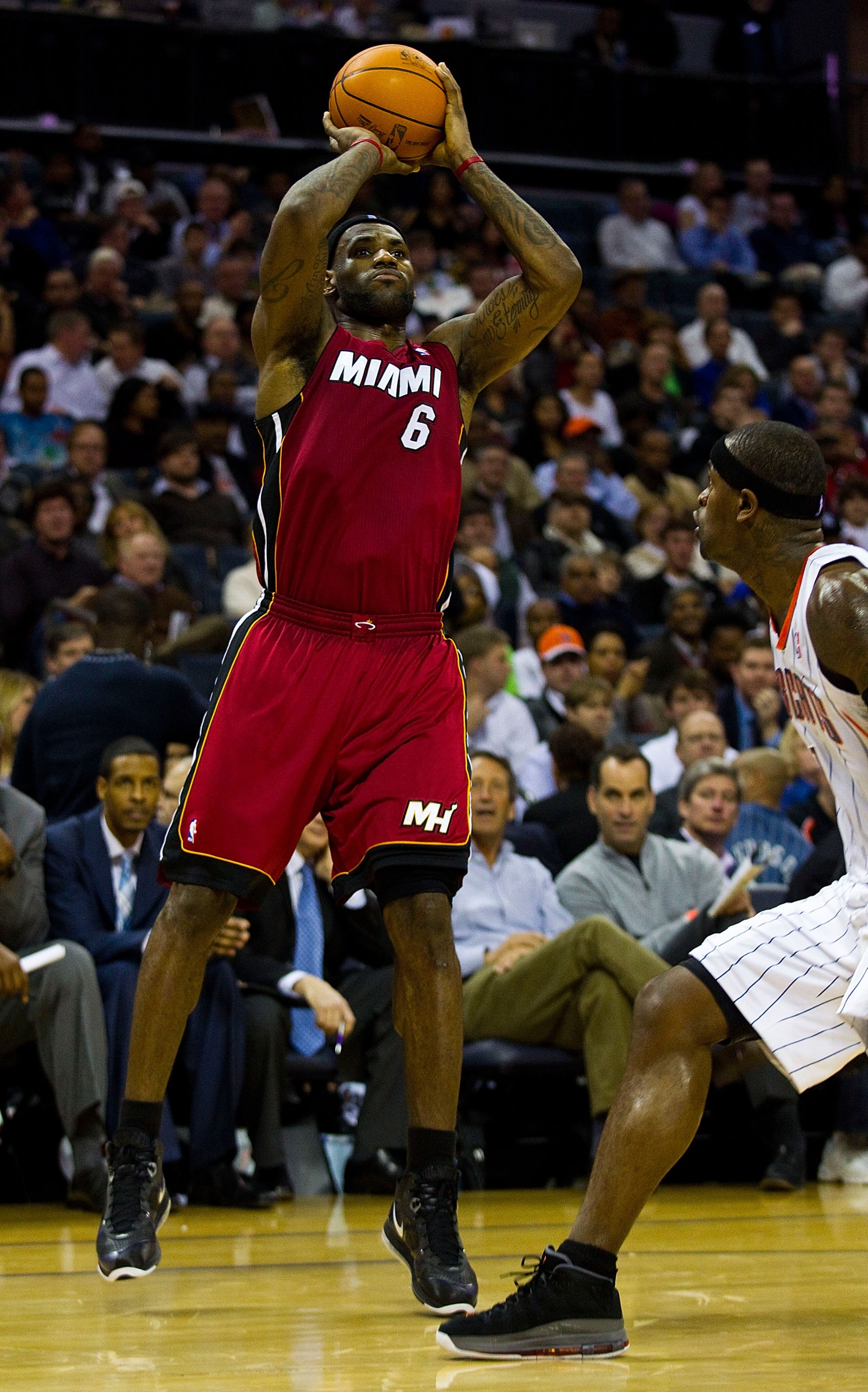 CHARLOTTE, NC - JANUARY 03: LeBron James #6 of the Miami Heat takes a jump shot over Stephen Jackson #1 of the Charlotte Bobcats at Time Warner Cable Arena on January 3, 2011 in Charlotte, North Carolina. The Heat defeated the Bobcats 96-82. (Photo by B CHARLOTTE, NC - JANUARY 03: LeBron James #6 of the Miami Heat takes a jump shot over Stephen Jackson #1 of the Charlotte Bobcats at Time Warner Cable Arena on January 3, 2011 in Charlotte, North Carolina. The Heat defeated the Bobcats 96-82. (Photo by B