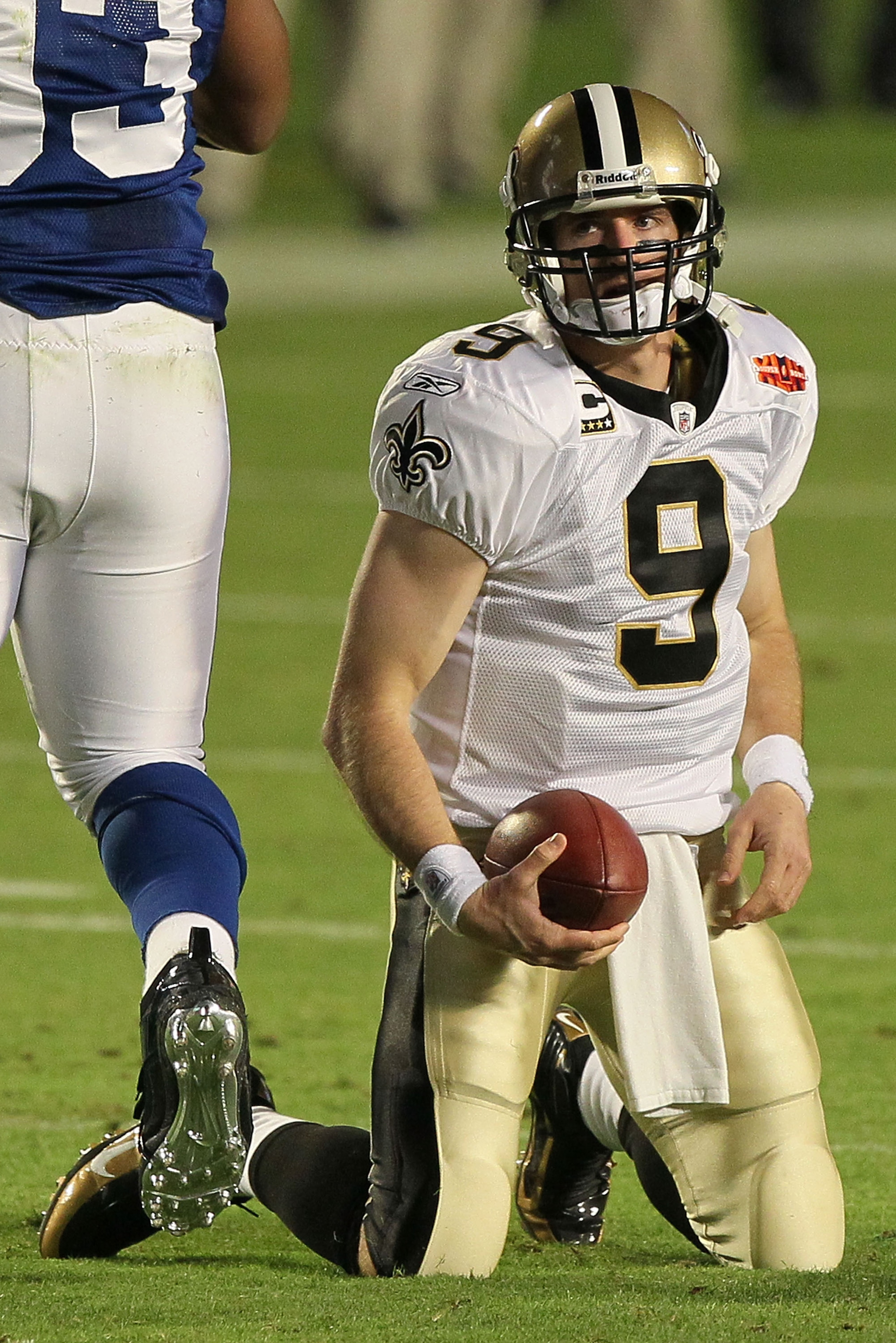 MIAMI GARDENS, FL - FEBRUARY 07:  Drew Brees #9 of the New Orleans Saints reacts after being sacked by Dwight Freeney #93 of the Indianapolis Colts during Super Bowl XLIV on February 7, 2010 at Sun Life Stadium in Miami Gardens, Florida.  (Photo by Jed Ja