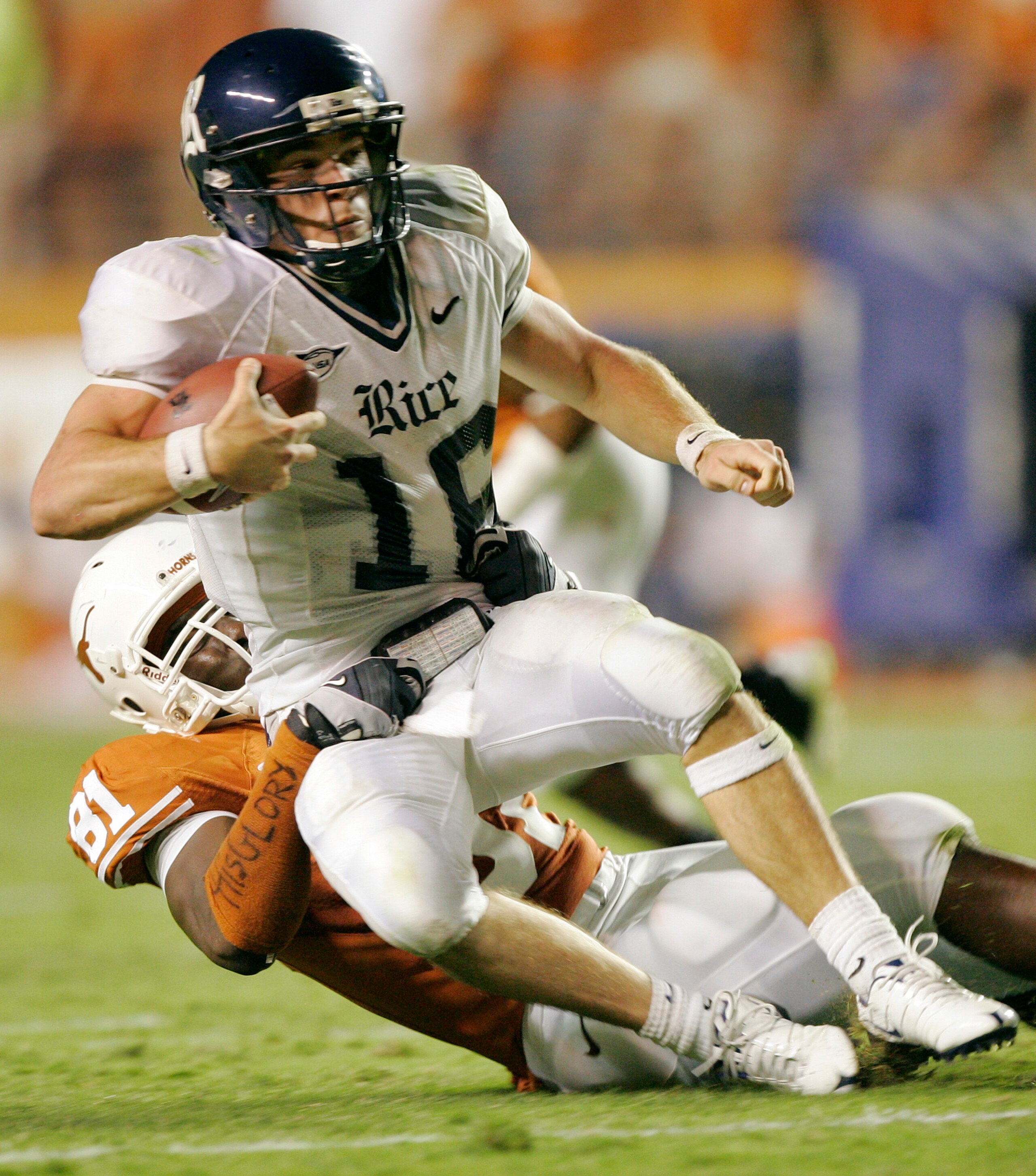 AUSTIN, TX - SEPTEMBER 20: Defensive end Sam Acho #81 of the Texas Longhorns brings down quarterback Chase Clement #16 of the Rice Owls in the fourth quarter on September 20, 2008 at Darrell K Royal-Texas Memorial Stadium in Austin, Texas. Texas won 52- AUSTIN, TX - SEPTEMBER 20: Defensive end Sam Acho #81 of the Texas Longhorns brings down quarterback Chase Clement #16 of the Rice Owls in the fourth quarter on September 20, 2008 at Darrell K Royal-Texas Memorial Stadium in Austin, Texas. Texas won 52-