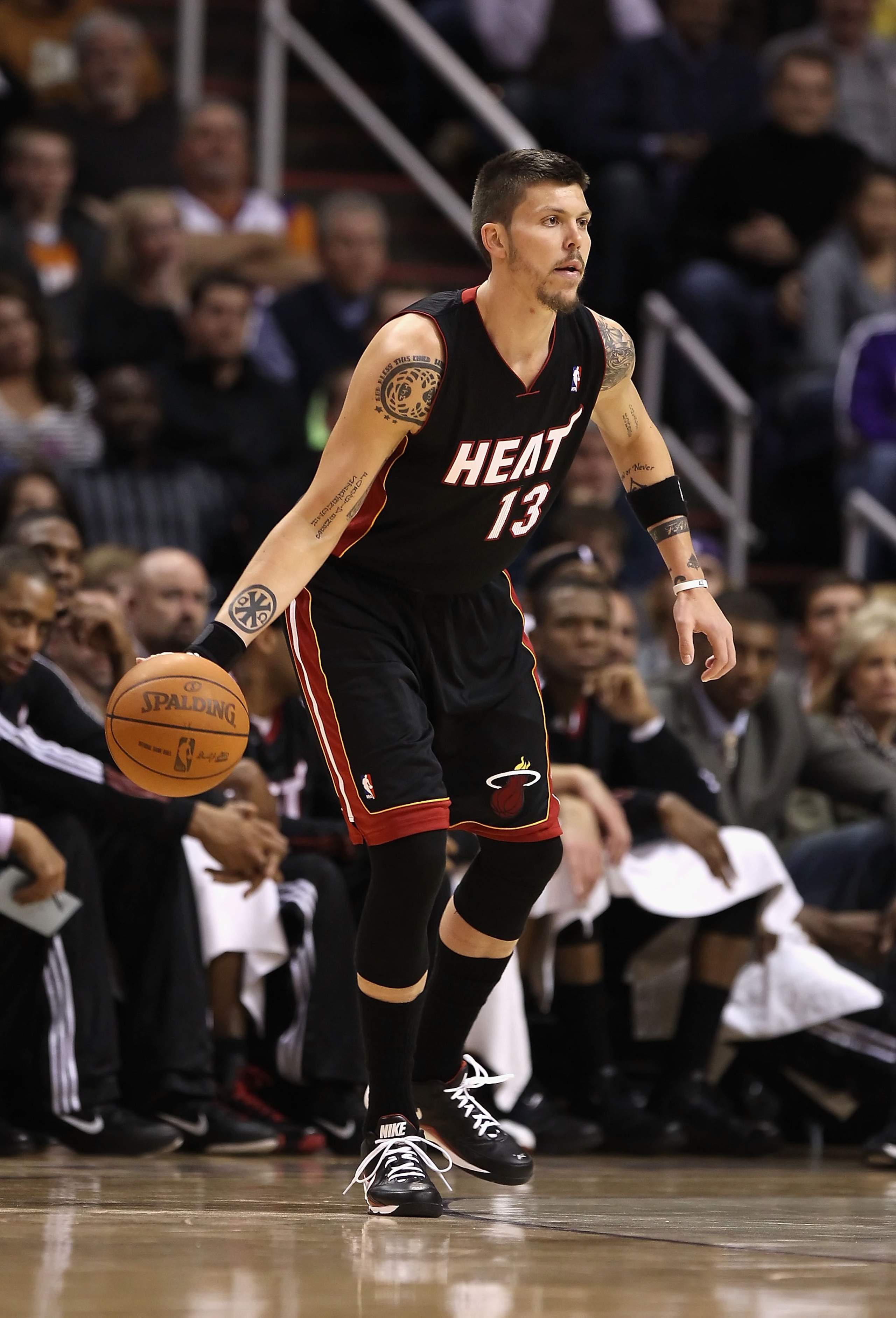 PHOENIX - DECEMBER 23: Mike Miller #13 of the Miami Heat handles the ball during the NBA game against the Phoenix Suns at US Airways Center on December 23, 2010 in Phoenix, Arizona. NOTE TO USER: User expressly acknowledges and agrees that, by downloadin PHOENIX - DECEMBER 23: Mike Miller #13 of the Miami Heat handles the ball during the NBA game against the Phoenix Suns at US Airways Center on December 23, 2010 in Phoenix, Arizona. NOTE TO USER: User expressly acknowledges and agrees that, by downloadin