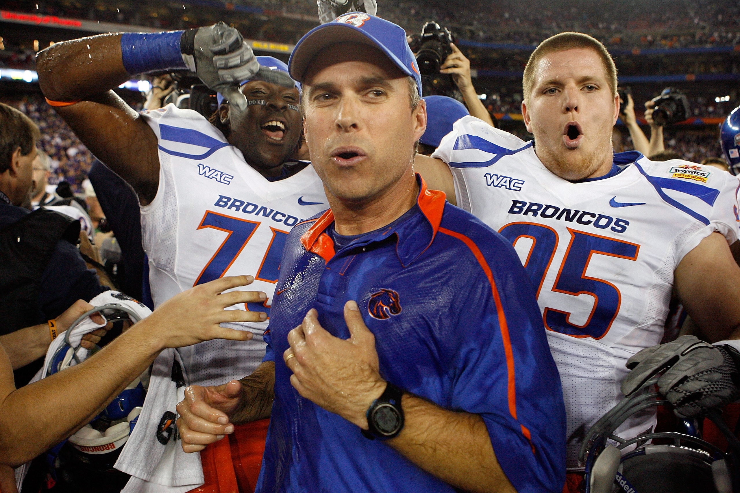 GLENDALE, AZ - JANUARY 04: Head coach Chris Petersen of the Boise State Broncos celebrates after defeating the TCU Horned Frogs 17-10 during the Tostitos Fiesta Bowl at the Universtity of Phoenix Stadium on January 4, 2010 in Glendale, Arizona. (Photo b GLENDALE, AZ - JANUARY 04: Head coach Chris Petersen of the Boise State Broncos celebrates after defeating the TCU Horned Frogs 17-10 during the Tostitos Fiesta Bowl at the Universtity of Phoenix Stadium on January 4, 2010 in Glendale, Arizona. (Photo b