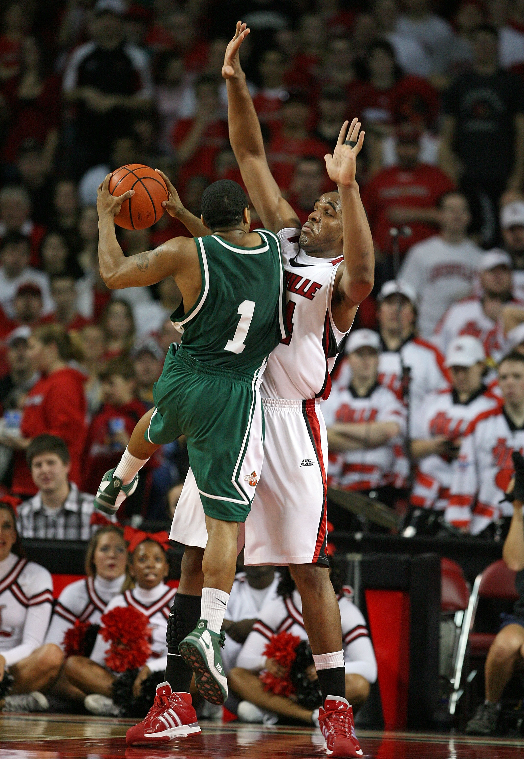 LOUISVILLE, KY - DECEMBER 27:  Samardo Samuels #24 of the Louisville Cardinals puts defensive pressure on Aaron Johnson #1 of the UAB Blazers during the game on December 27, 2008 at Freedom Hall in Louisville, Kentucky.  Louisville won 82-62.  (Photo by A