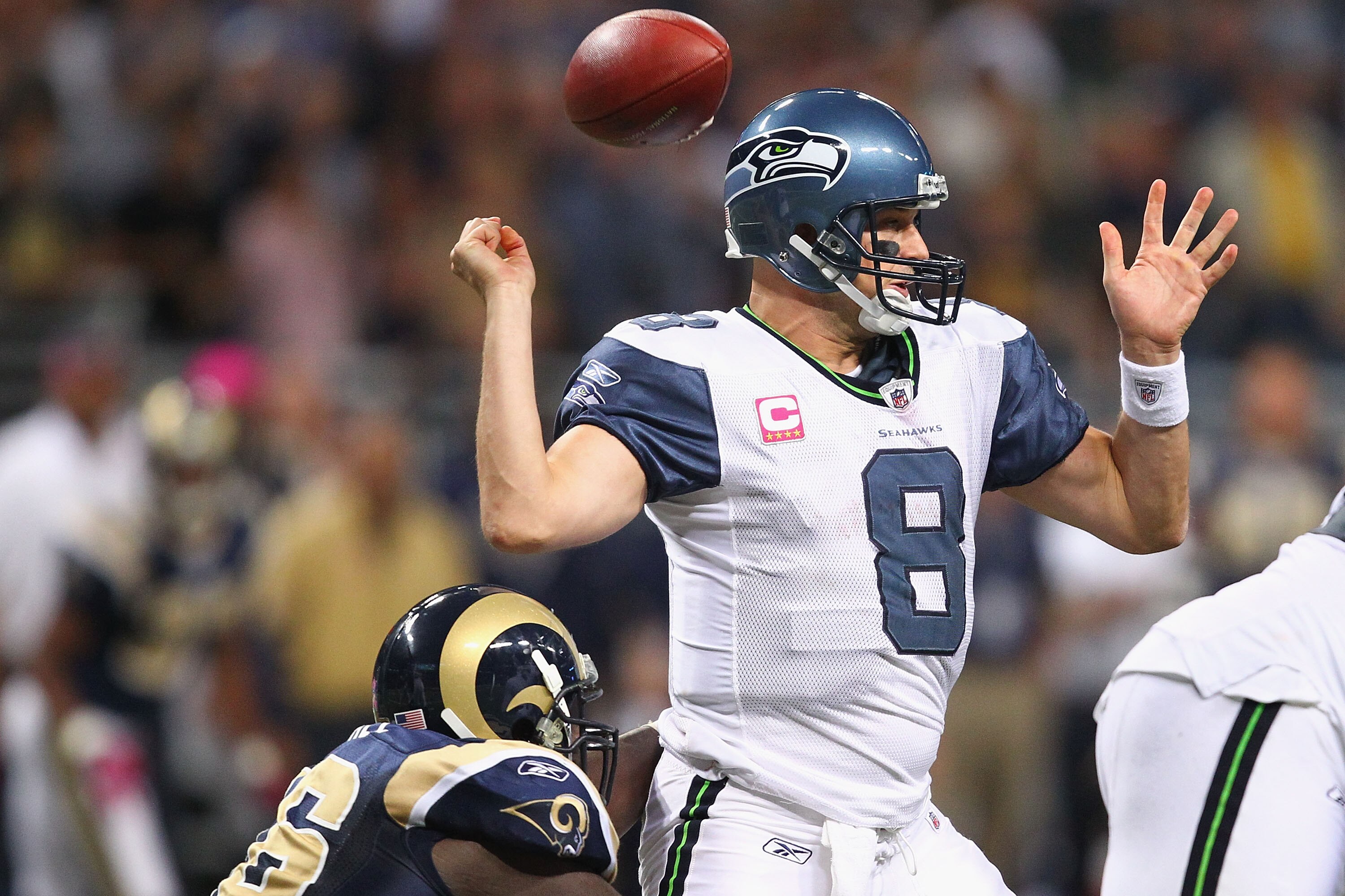 ST. LOUIS - OCTOBER 3: Matt Hasselbeck #8 of the Seattle Seahawks fumbles the ball against the St. Louis Rams at the Edward Jones Dome on October 3, 2010 in St. Louis, Missouri.  The Rams beat the Seahawks 20-3.  (Photo by Dilip Vishwanat/Getty Images)