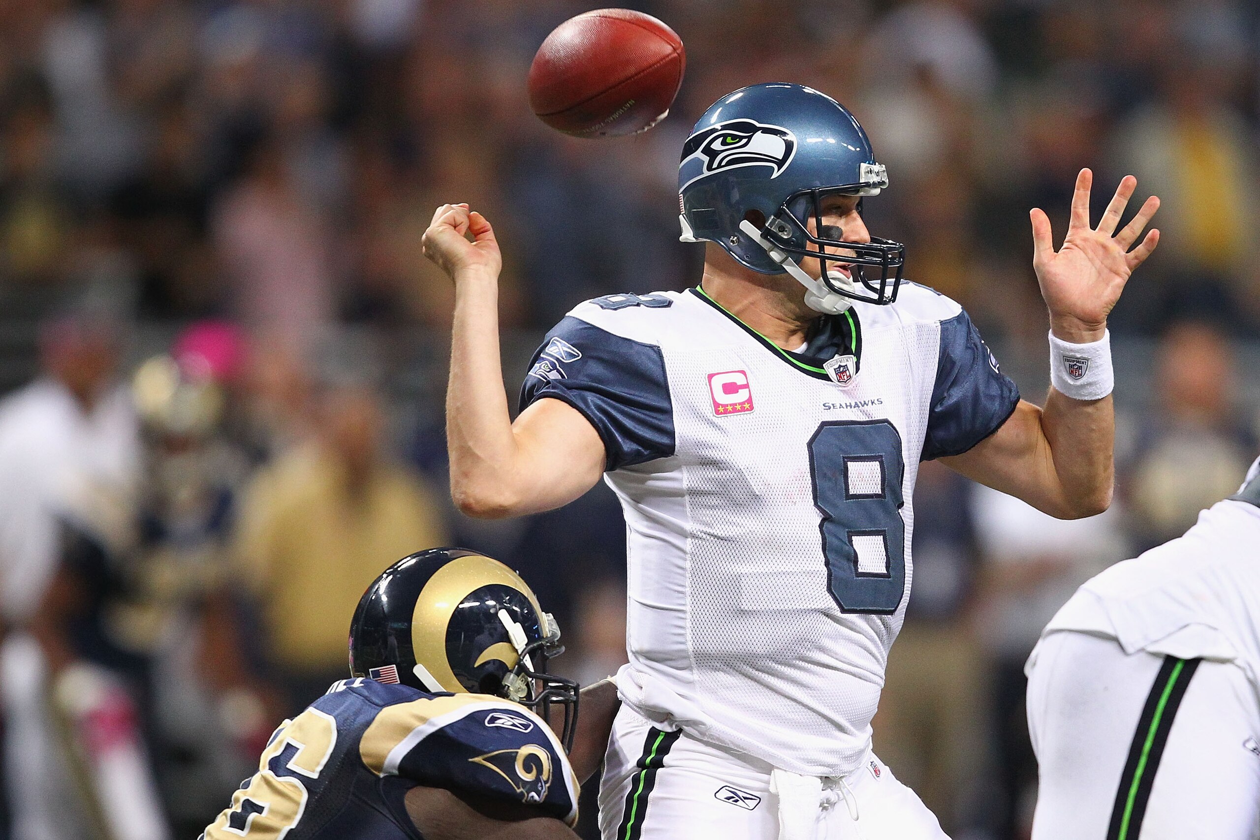 ST. LOUIS - OCTOBER 3: Matt Hasselbeck #8 of the Seattle Seahawks fumbles the ball against the St. Louis Rams at the Edward Jones Dome on October 3, 2010 in St. Louis, Missouri.  The Rams beat the Seahawks 20-3.  (Photo by Dilip Vishwanat/Getty Images)