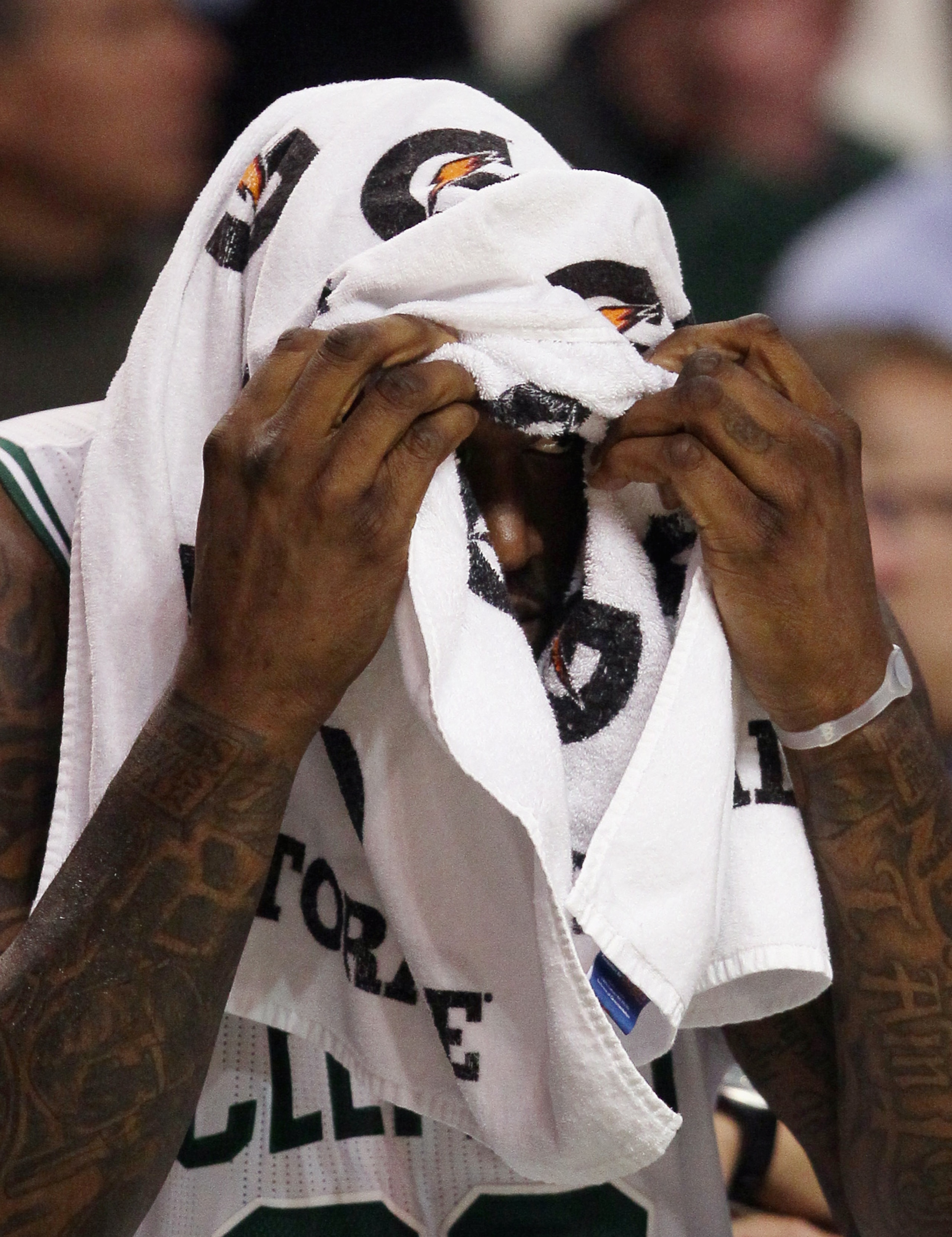 BOSTON, MA - JANUARY 03: Shaquille O'Neal #36 of the Boston Celtics peaks out from under a towel in the second half against the Minnesota Timberwolves on January 3, 2011 at the TD Garden in Boston, Massachusetts. The Celtics defeated the Timberwolves 96- BOSTON, MA - JANUARY 03: Shaquille O'Neal #36 of the Boston Celtics peaks out from under a towel in the second half against the Minnesota Timberwolves on January 3, 2011 at the TD Garden in Boston, Massachusetts. The Celtics defeated the Timberwolves 96-
