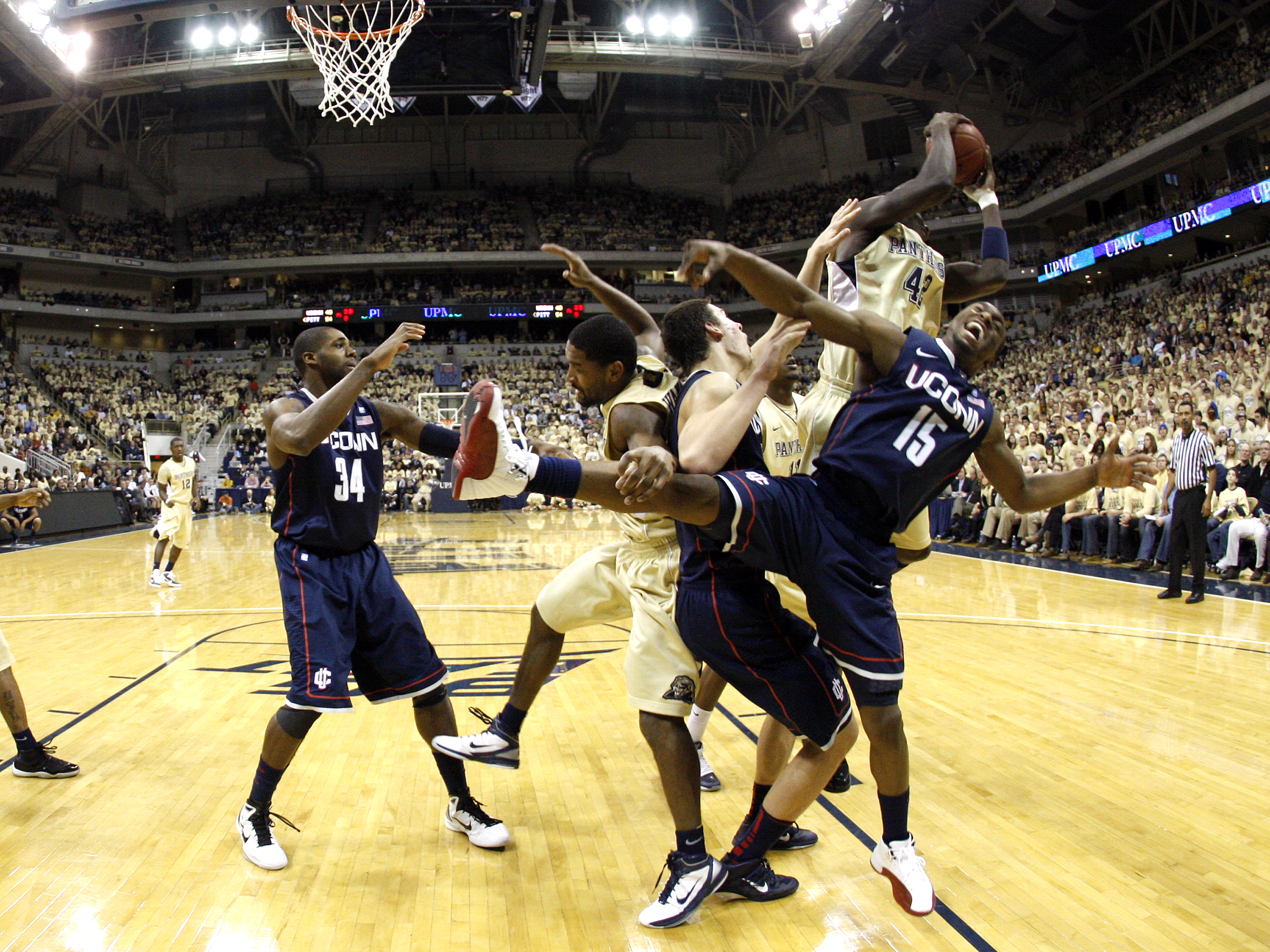 PITTSBURGH, PA - DECEMBER 27:  Kemba Walker #15 of the Connecticut Huskies battles for a rebound against Talib Zanna #42 of the Pittsburgh Panthers at Petersen Events Center on December 27, 2010 in Pittsburgh, Pennsylvania.  Pittsburgh defeated Connecticu