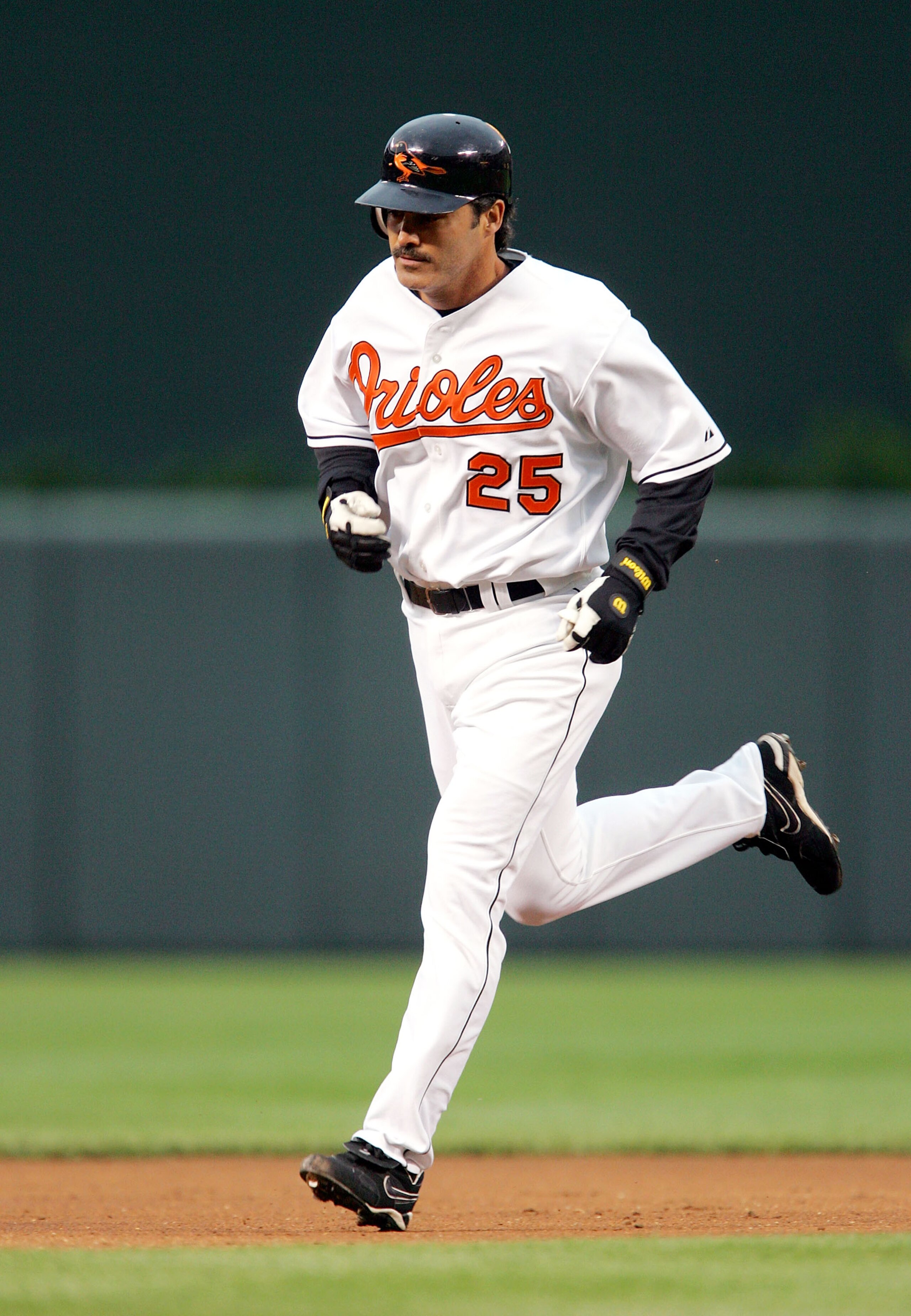 BALTIMORE, MD - MAY 25:  Rafael Palmiero #25 of the Baltimore Orioles rounds the bases after hitting a 2-run home run during the second inning of the game against the Seattle Mariners on May 25, 2005 at Camden Yards in Baltimore, Maryland.  (Photo By Jami