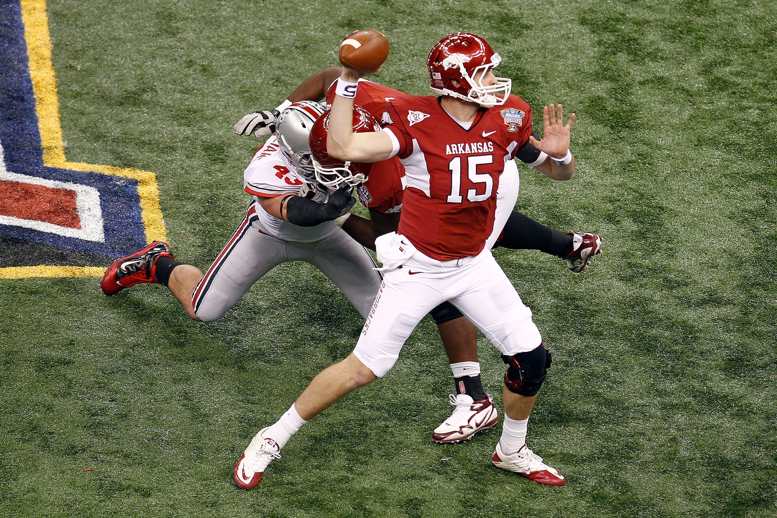 NEW ORLEANS, LA - JANUARY 04:  Quarterback Ryan Mallett #15 of the Arkansas Razorbacks throws the ball in the first quarter against the Ohio State Buckeyes during the Allstate Sugar Bowl at the Louisiana Superdome on January 4, 2011 in New Orleans, Louisi