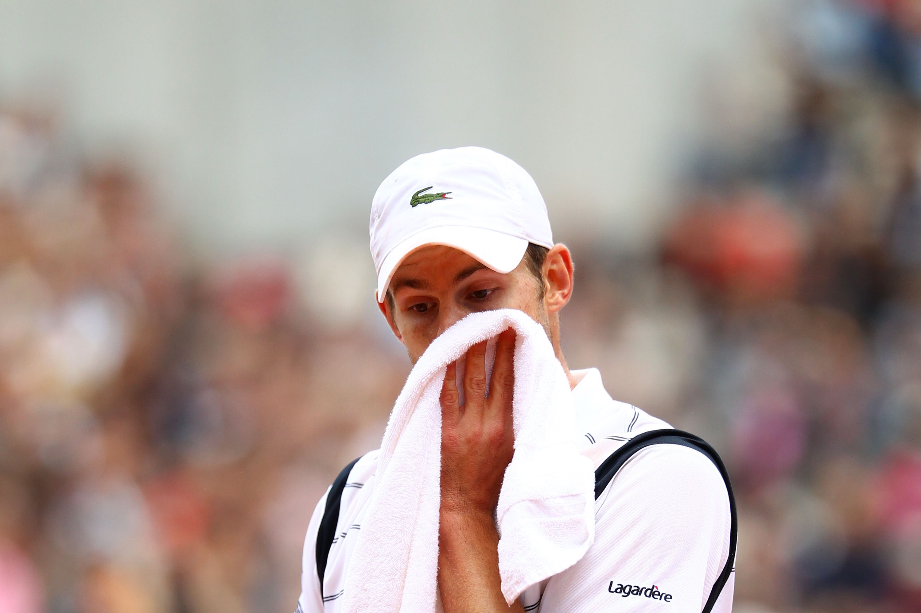 PARIS - MAY 29:  Andy Roddick of the United States shows his dejection during the men's singles third round match between Andy Roddick of the United States and Teimuraz Gabashvili of Russia on day seven of the French Open at Roland Garros on May 29, 2010