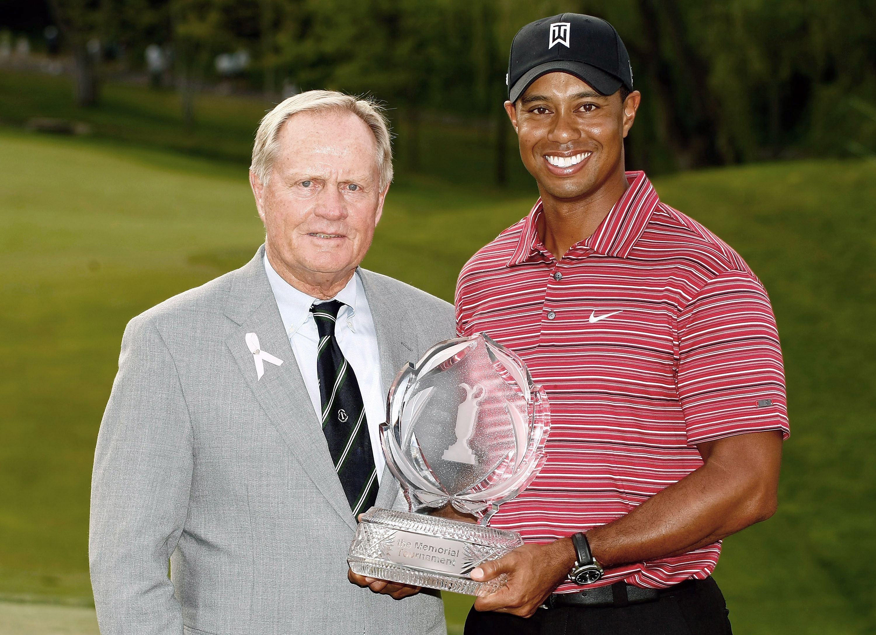 DUBLIN, OH - JUNE 07: Jack Nicklaus presents Tiger Woods with the trophy after his one-stroke victory at the Memorial Tournament at the Muirfield Village Golf Club on June 7, 2009 in Dublin, Ohio. (Photo by Scott Halleran/Getty Images)