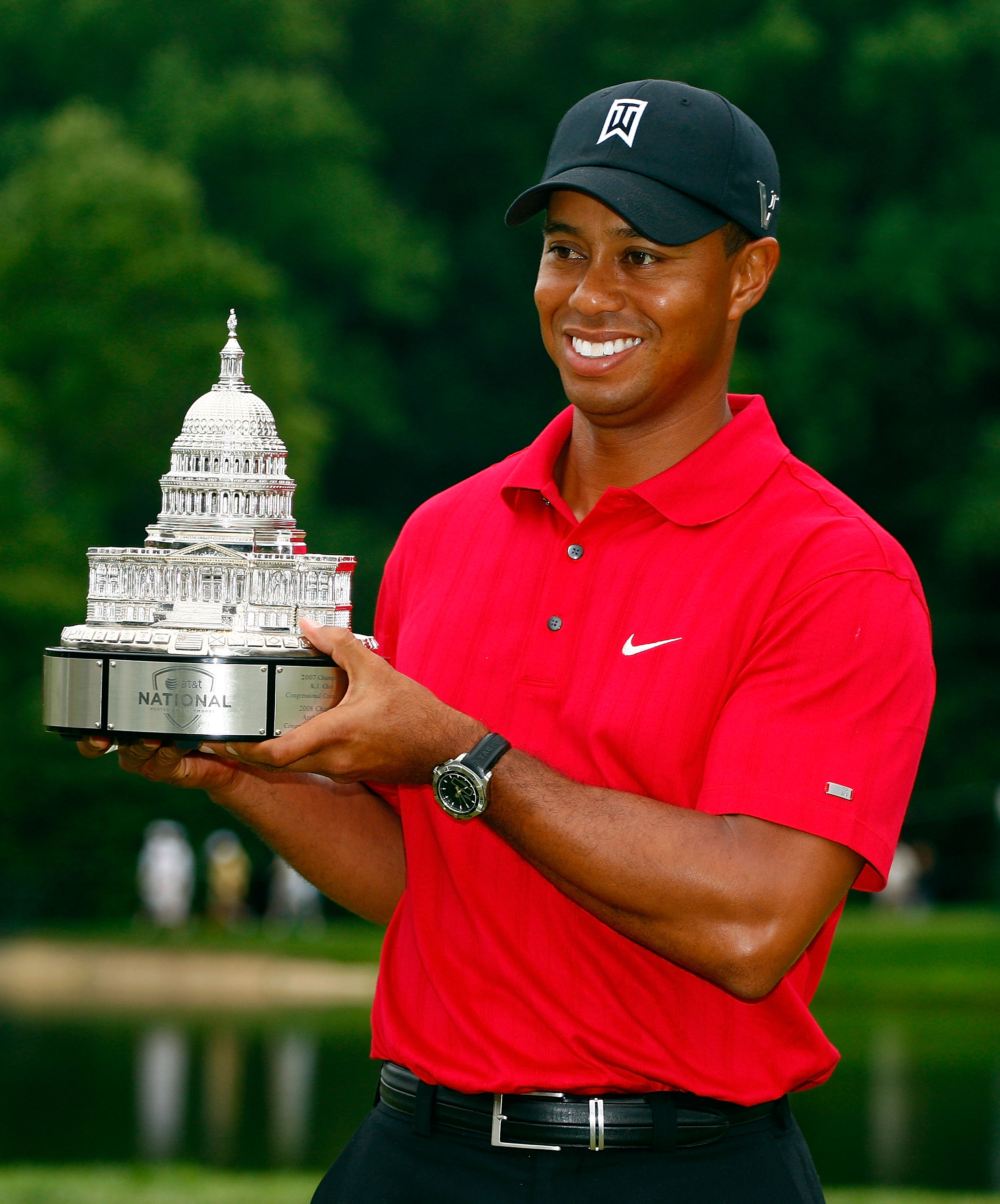BETHESDA, MD - JULY 05:  Tiger Woods poses with the trophy after his one-stroke victory at the AT&T National at the Congressional Country Club on July 5, 2009 in Bethesda, Maryland.  (Photo by Scott Halleran/Getty Images)