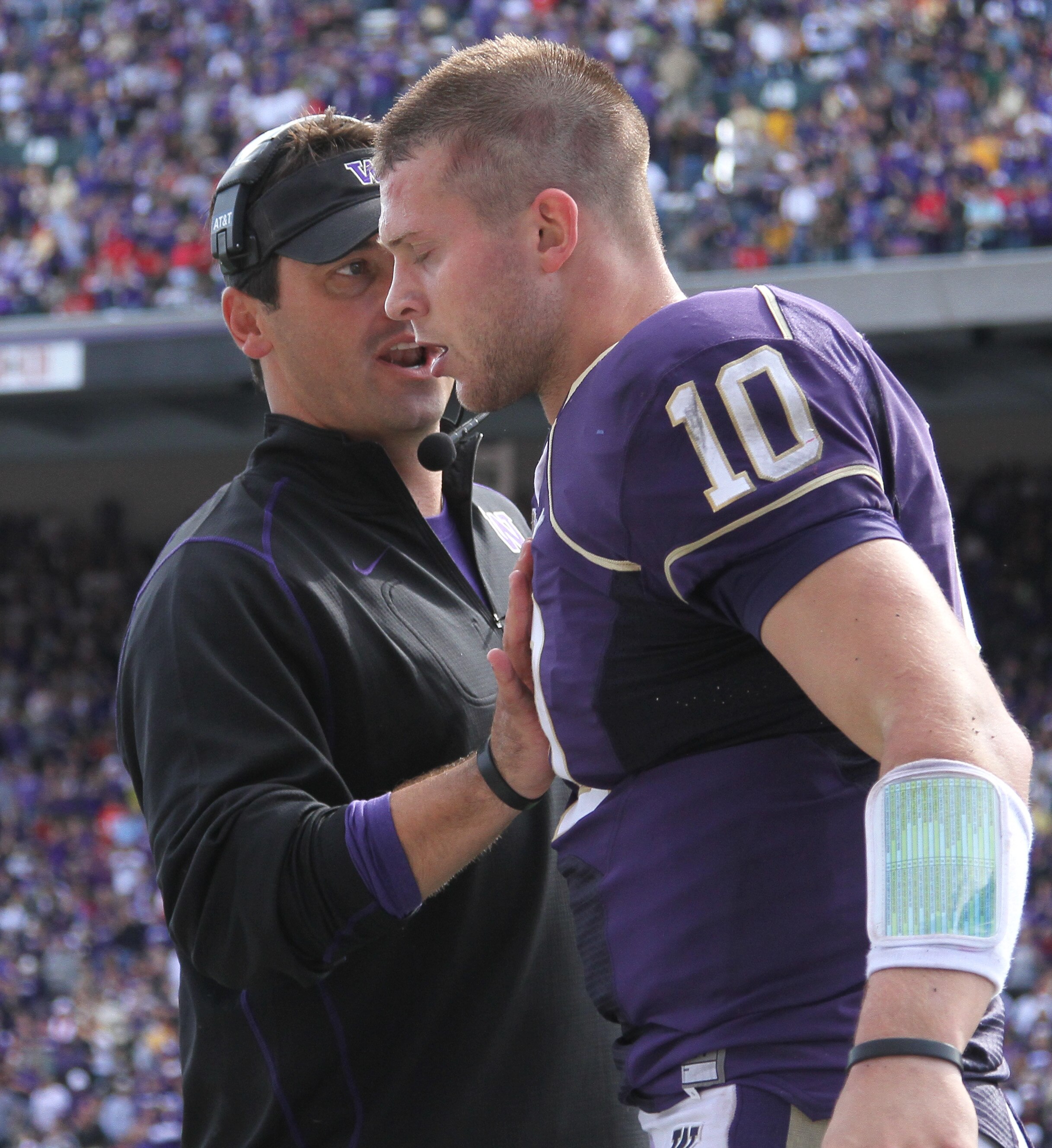 SEATTLE - SEPTEMBER 18: Head coach Steve Sarkisian of the Washington Huskies talks to quarterback Jake Locker #10 after the Huskies scored a touchdown against the Nebraska Cornhuskers on September 18, 2010 at Husky Stadium in Seattle, Washington. (Photo b