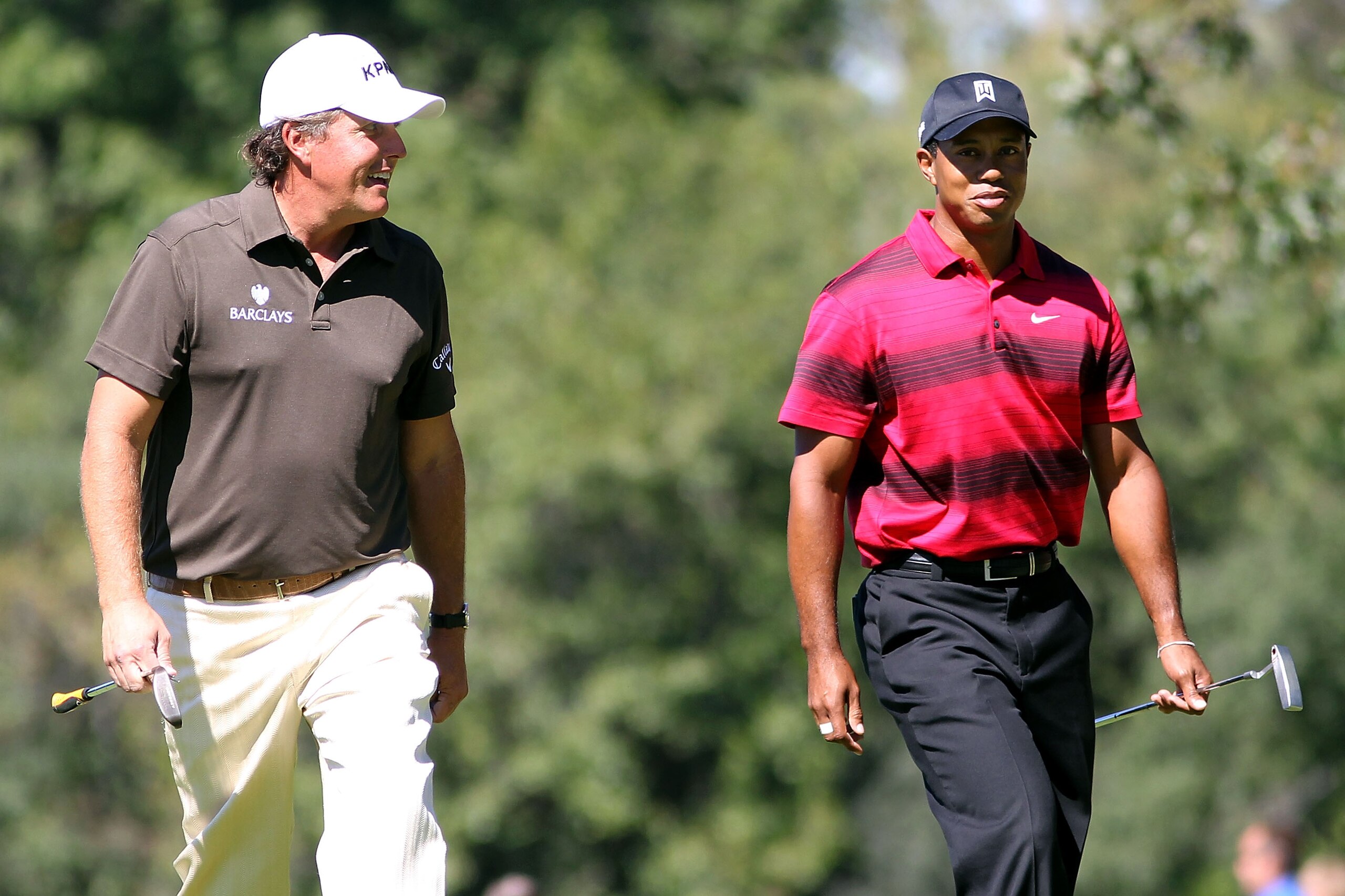 LEMONT, IL - SEPTEMBER 12:  (L-R) Phil Mickelson and Tiger Woods walk down the fifth fairway during the final round of the BMW Championship at Cog Hill Golf & Country Club on September 12, 2010 in Lemont, Illinois.  (Photo by Maxx Wolfson/Getty Images)