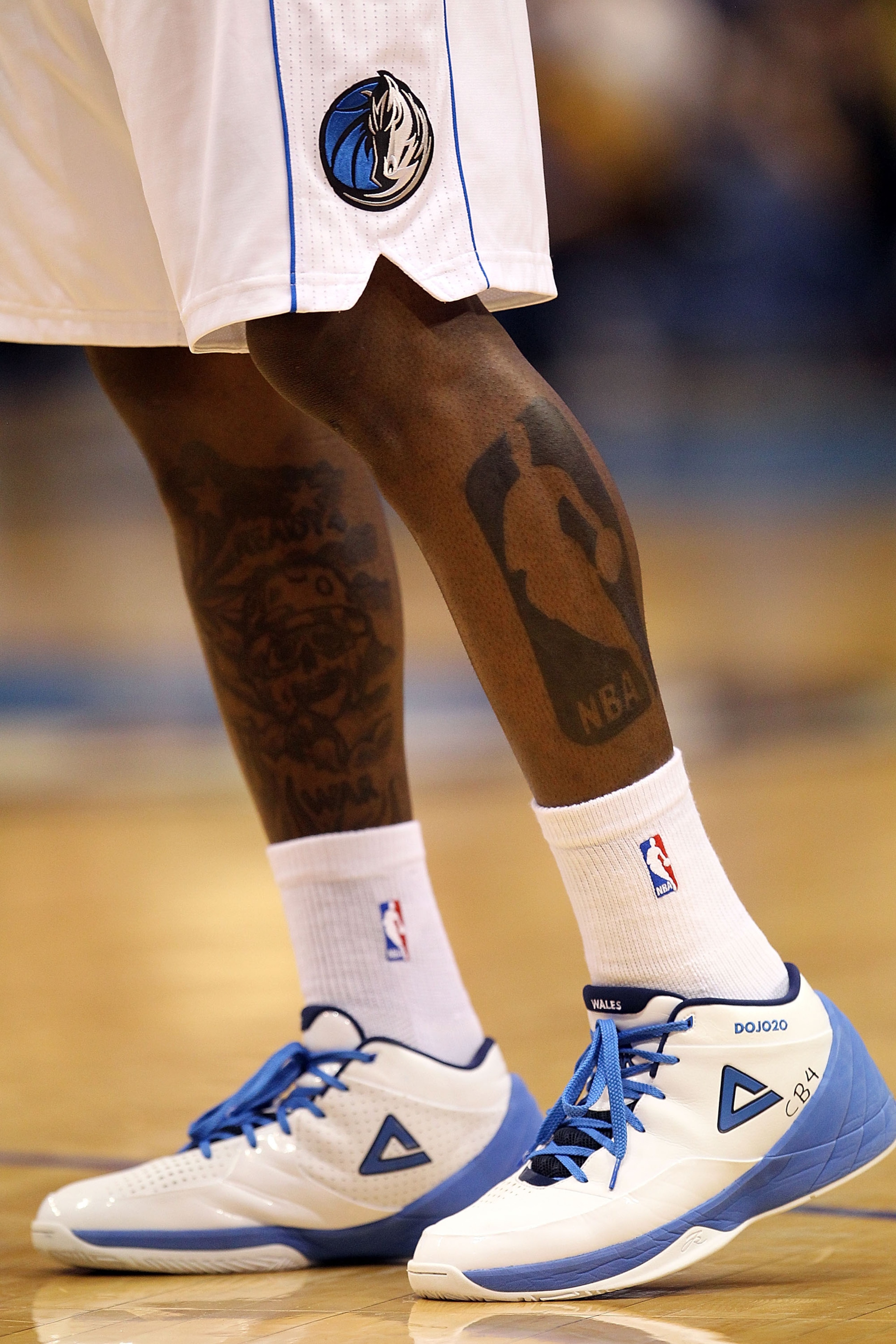 DALLAS, TX - JANUARY 04:  The NBA logo tattoo of Dominique Jones #20 of the Dallas Mavericks during a game against the Portland Trail Blazers at American Airlines Center on January 4, 2011 in Dallas, Texas.  NOTE TO USER: User expressly acknowledges and a
