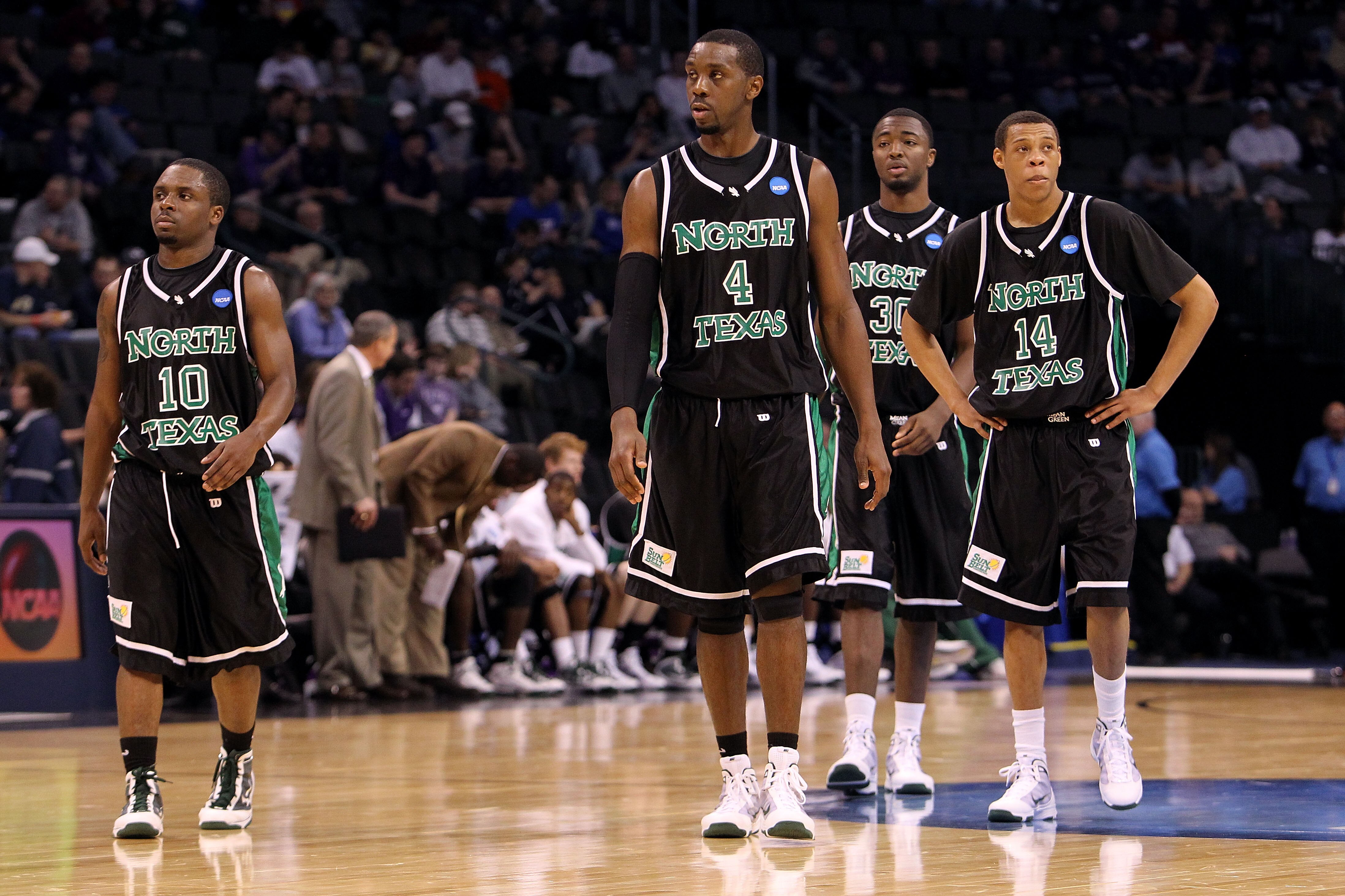 OKLAHOMA CITY - MARCH 18:  (L-R) Josh White #10, George Odufuwa #4, Jacob Holmen #30 and Tristian Thompson #14 of the North Texas Mean Green look on dejected against the Kansas State Wildcats during the first round of the 2010 NCAA men's basketball tourna