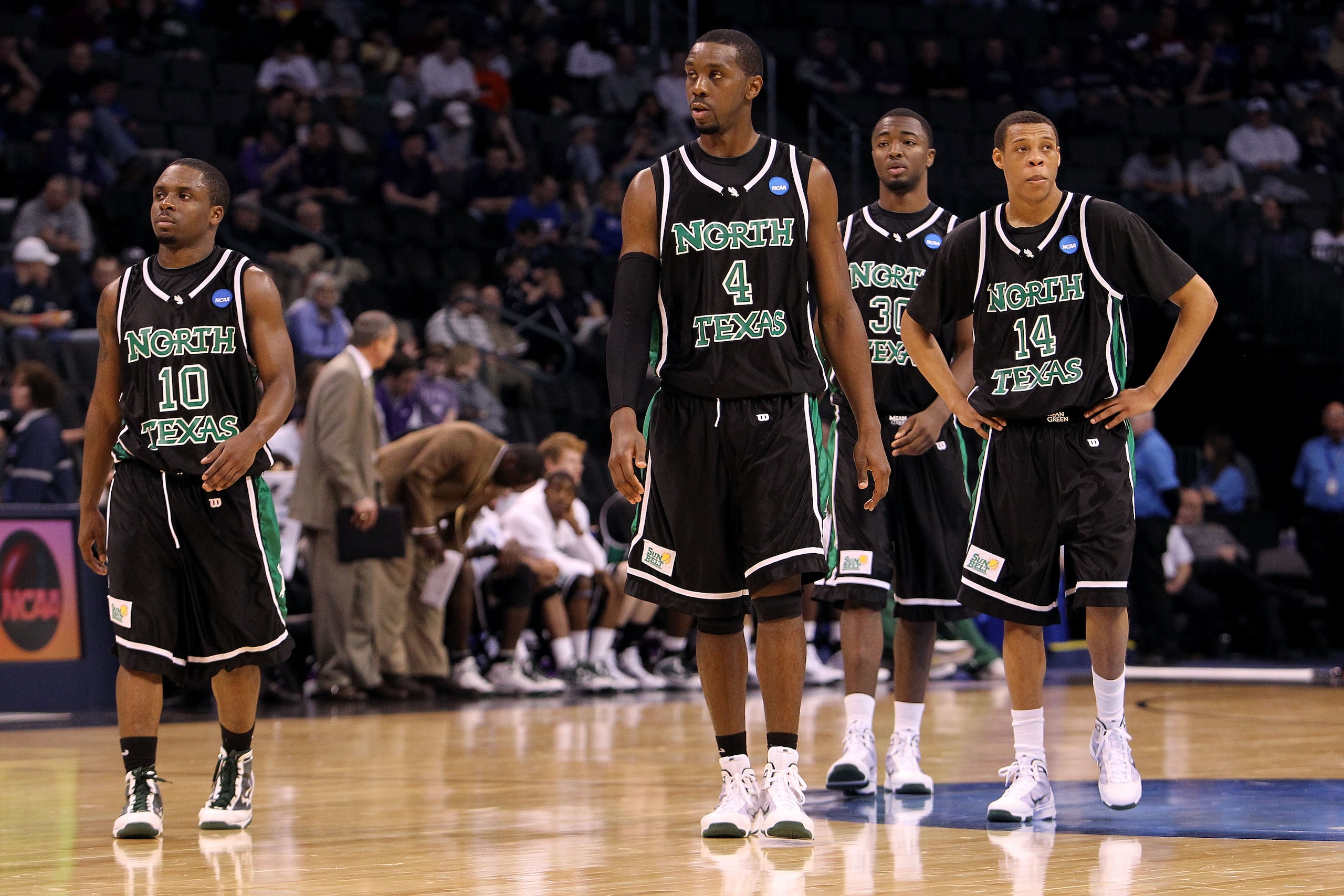 OKLAHOMA CITY - MARCH 18:  (L-R) Josh White #10, George Odufuwa #4, Jacob Holmen #30 and Tristian Thompson #14 of the North Texas Mean Green look on dejected against the Kansas State Wildcats during the first round of the 2010 NCAA men's basketball tourna