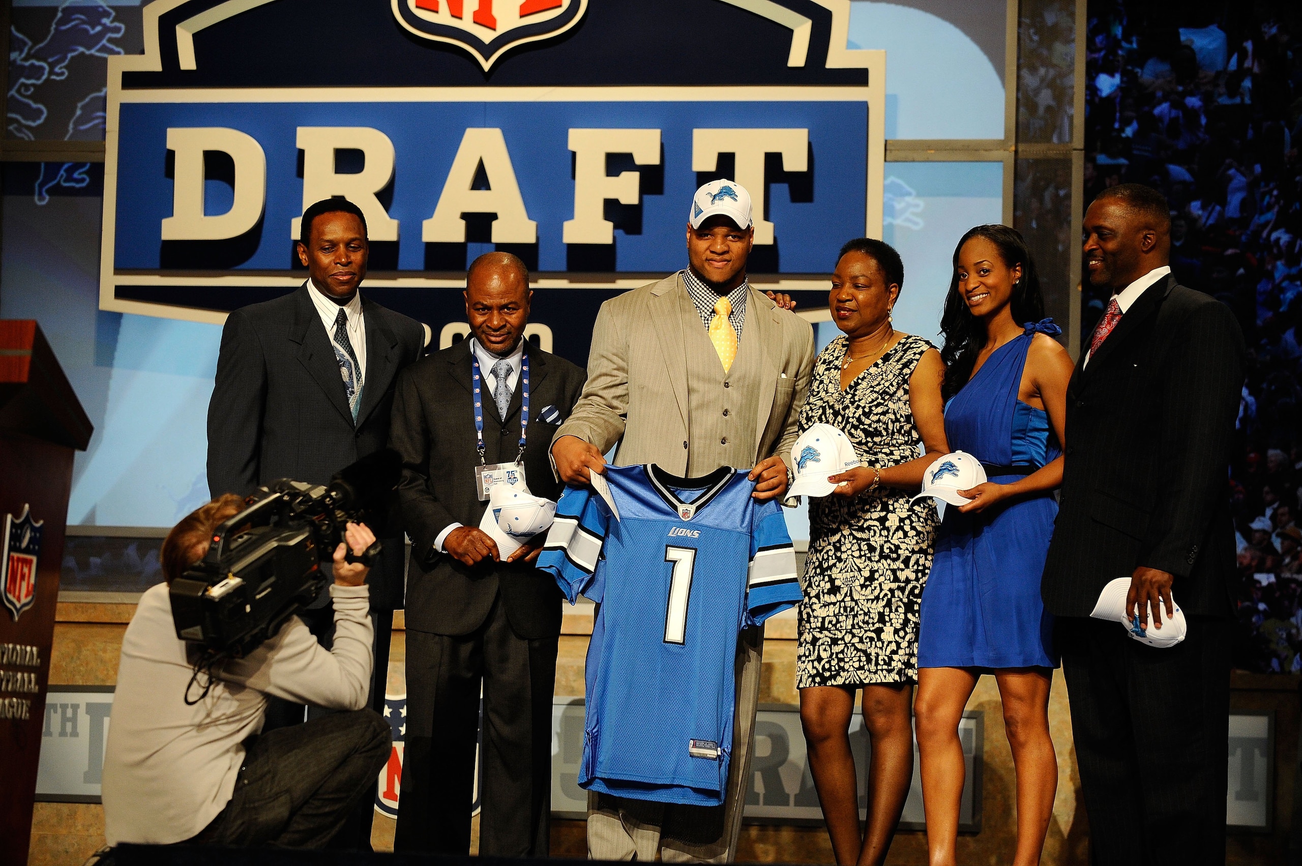NEW YORK - APRIL 22:  Ndamukong Suh of the Nebraska Cornhuskers holds up a Detroit Lions jersey as he poses with family after he was picked #2 overall by the Lions during the first round of the 2010 NFL Draft at Radio City Music Hall on April 22, 2010 in 