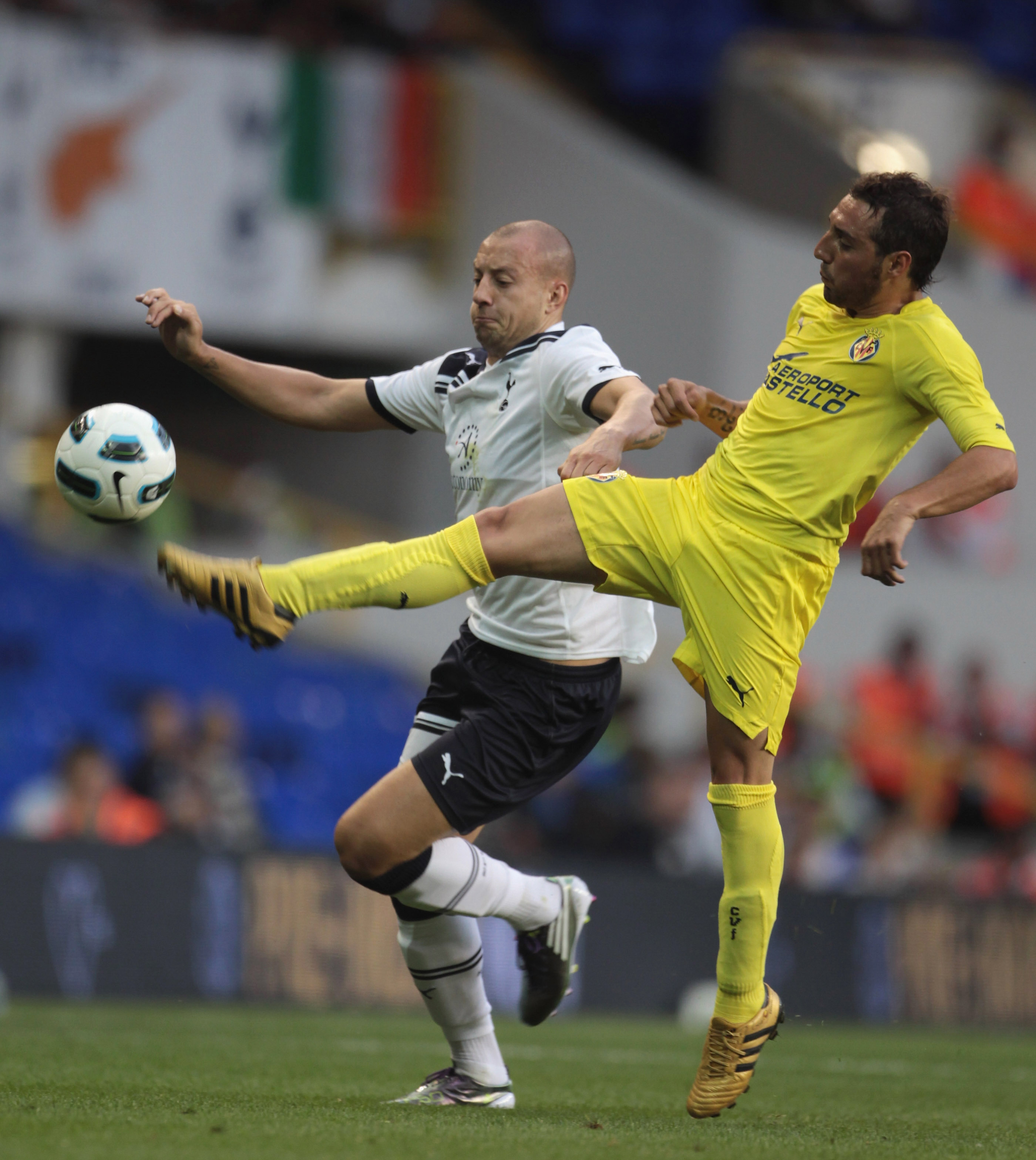 LONDON, ENGLAND - JULY 29: Santi Cazorla of Villarreal (R) tackles Alan Hutton of Tottenham Hotspur during a Pre-Season Friendly between Tottenham Hotspur and  Villarreal at White Hart Lane on July 29, 2010 in London, England.  (Photo by Phil Cole/Getty I