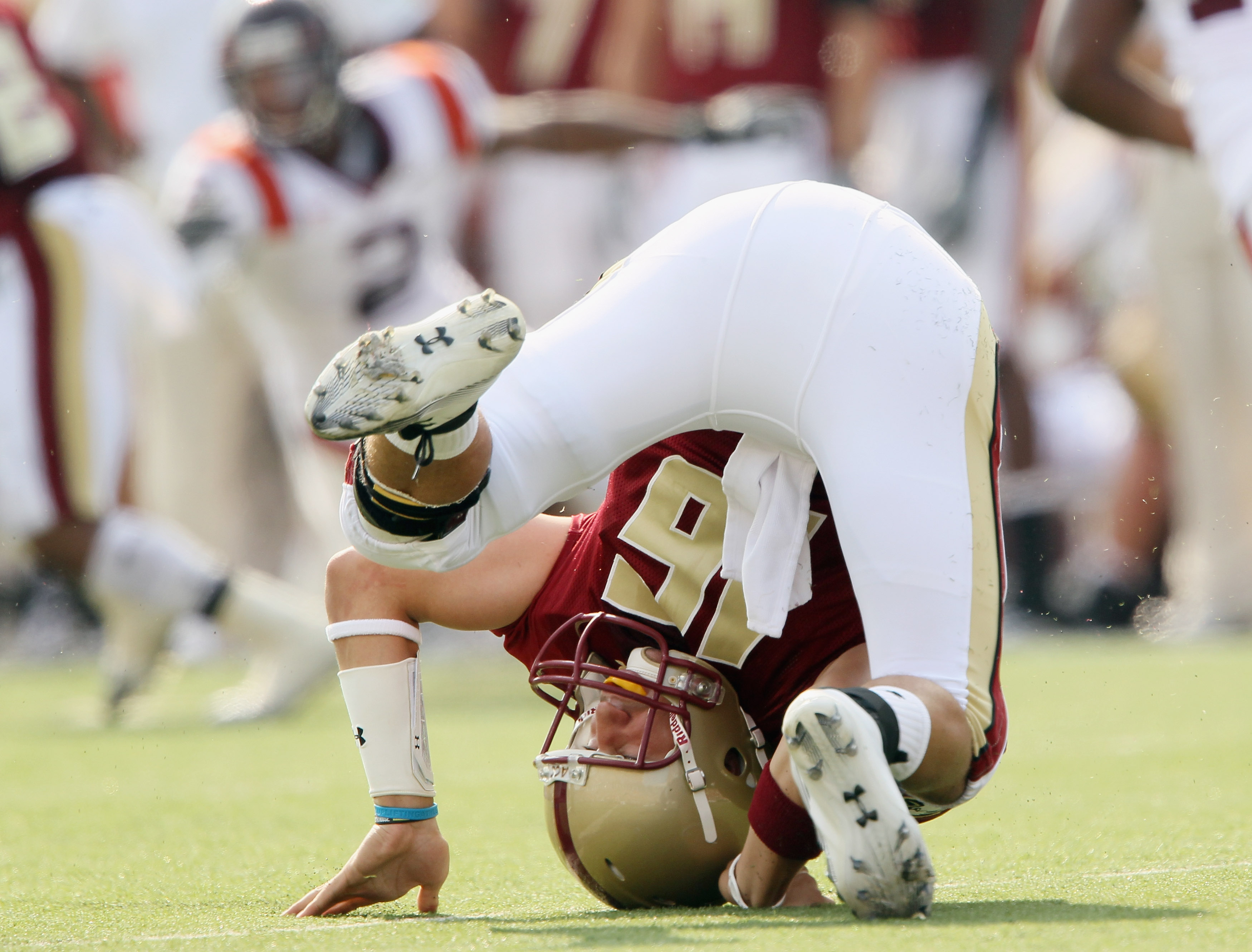 CHESTNUT HILL, MA - SEPTEMBER 25: Mike Marscovetra #16 of the Boston College Eagles topples over after he is pressured in the fourth quarter against the Virginia Tech Hokies on September 25, 2010 at Alumni Stadium in Chestnut Hill, Massachusetts. Virgini