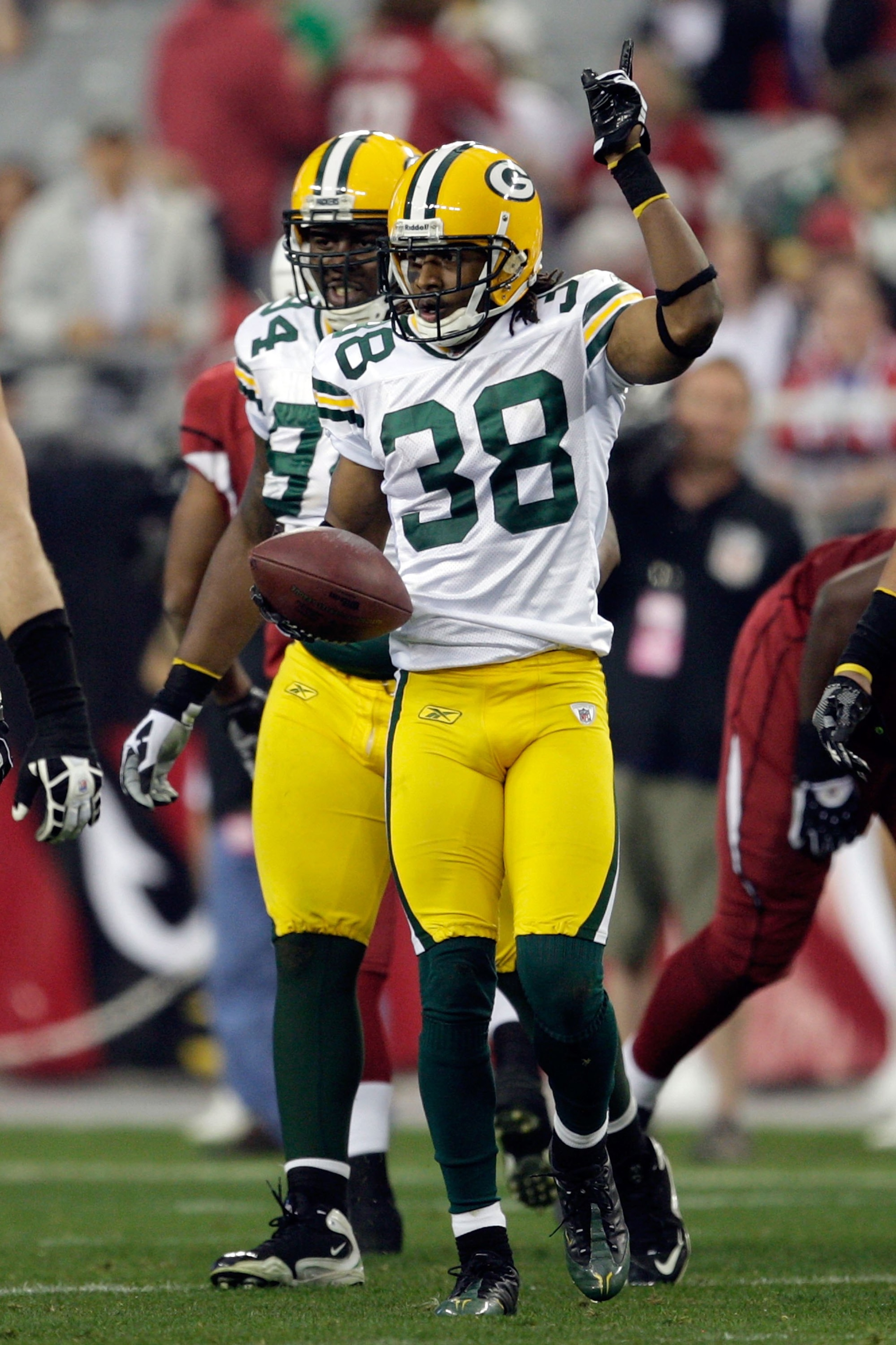 GLENDALE, AZ - JANUARY 03:  Tramon Williams #38 of the Green Bay Packers reacts against the Arizona Cardinals at University of Phoenix Stadium on January 3, 2010 in Glendale, Arizona.  (Photo by Jamie Squire/Getty Images)