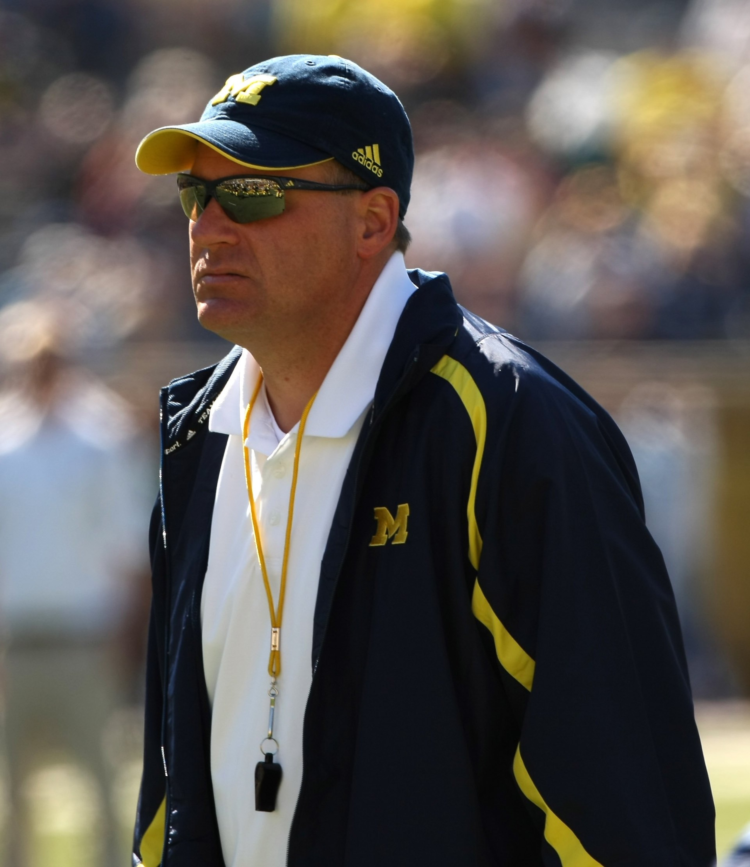 ANN ARBOR, MI - SEPTEMBER 19: Head coach Rich Rodriguez of the Michigan Wolverines watches warmups before the game with the Eastern Michigan Eagles at Michigan Stadium on September 19, 2009 in Ann Arbor, Michigan. Michigan won 45-17. (Photo by Stephen ANN ARBOR, MI - SEPTEMBER 19: Head coach Rich Rodriguez of the Michigan Wolverines watches warmups before the game with the Eastern Michigan Eagles at Michigan Stadium on September 19, 2009 in Ann Arbor, Michigan. Michigan won 45-17. (Photo by Stephen