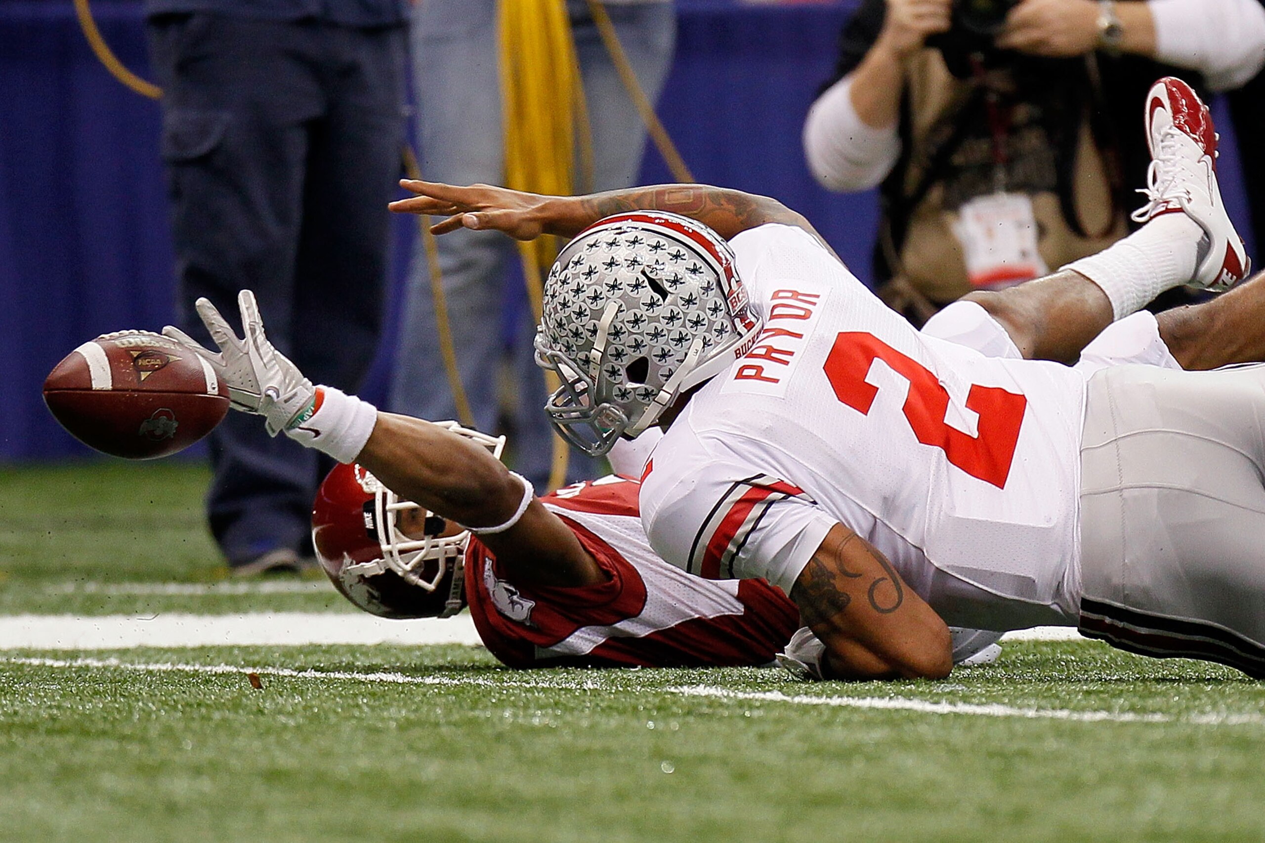NEW ORLEANS, LA - JANUARY 04:  Terrelle Pryor #2 of the Ohio State Buckeyes fumbles the football in the first quarter against the Arkansas Razorbacks during the Allstate Sugar Bowl at the Louisiana Superdome on January 4, 2011 in New Orleans, Louisiana. P