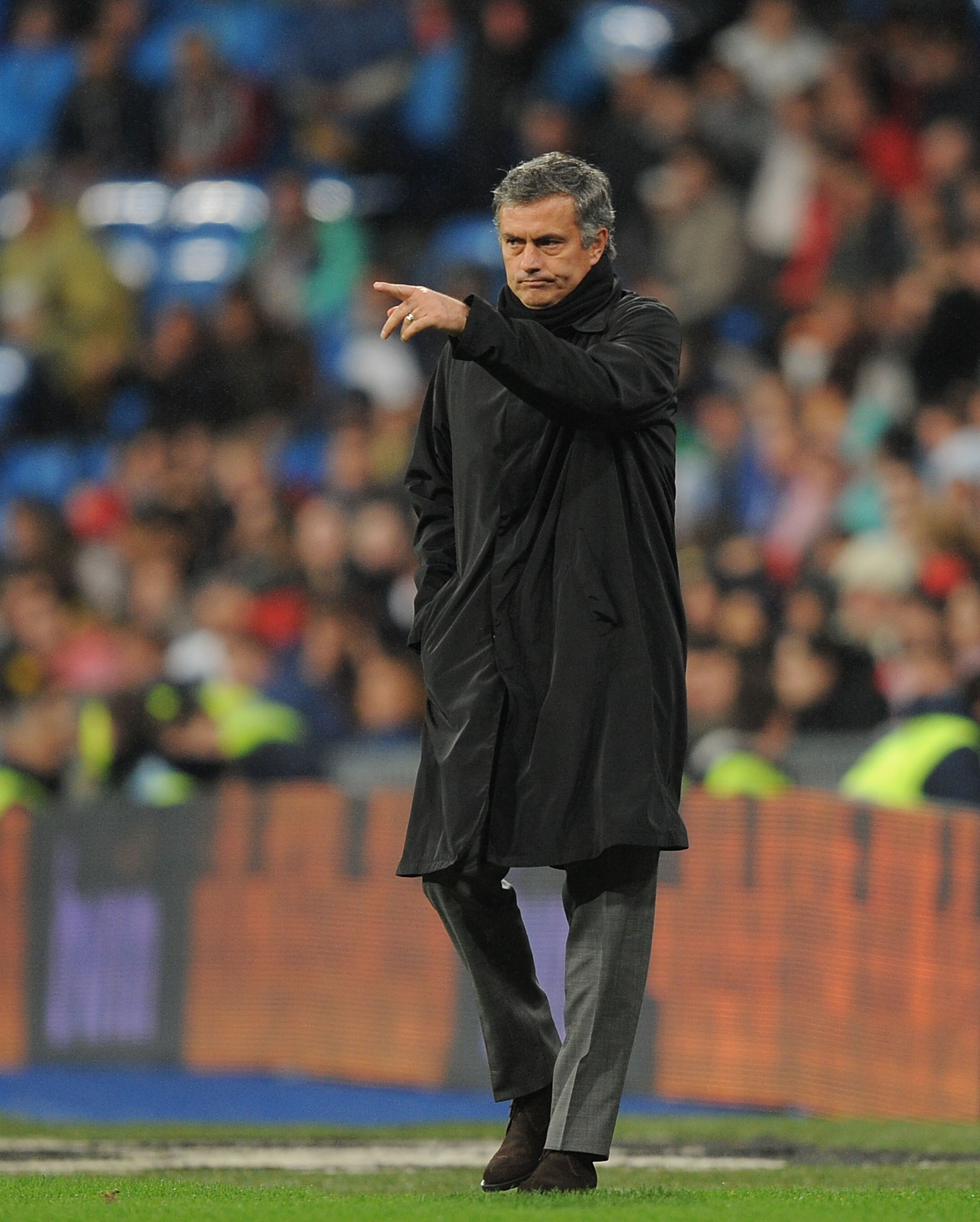 MADRID, SPAIN - DECEMBER 22:  Head coach Jose Mourinho of Real Madrid organizes his team during the first leg round of 16 Copa del Rey match between Real Madrid and Levante at Estadio Santiago Bernabeu on December 22, 2010 in Madrid, Spain.  (Photo by Den