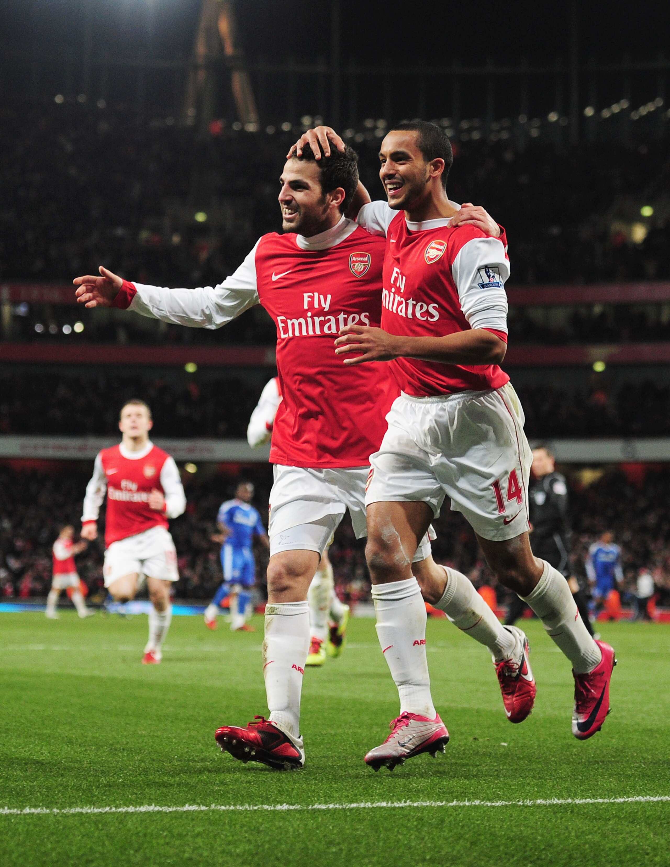 LONDON, ENGLAND - DECEMBER 27:  Cesc Fabregas of Arsenal celebrates Arsenal's second goal with Theo Walcott (R) during the Barclays Premier League match between Arsenal and Chelsea at the Emirates Stadium on December 27, 2010 in London, England.  (Photo b