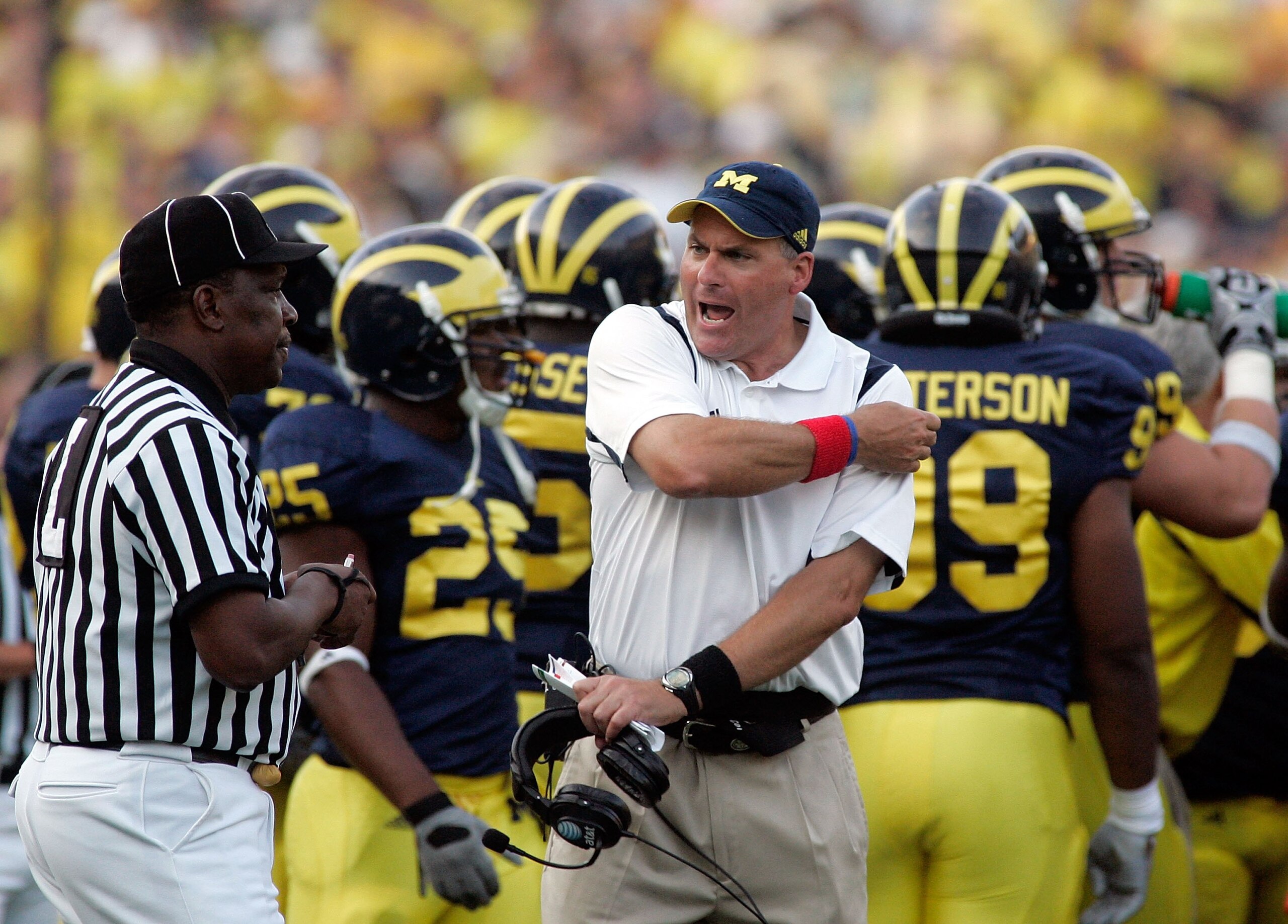 ANN ARBOR, MI - SEPTEMBER 12:  Michigan head coach Rich Rodriguez disputes a call with and official against Notre Dame at Michigan Stadium on September 12, 2009 in Ann Arbor, Michigan.  (Photo by Domenic Centofanti/Getty Images)