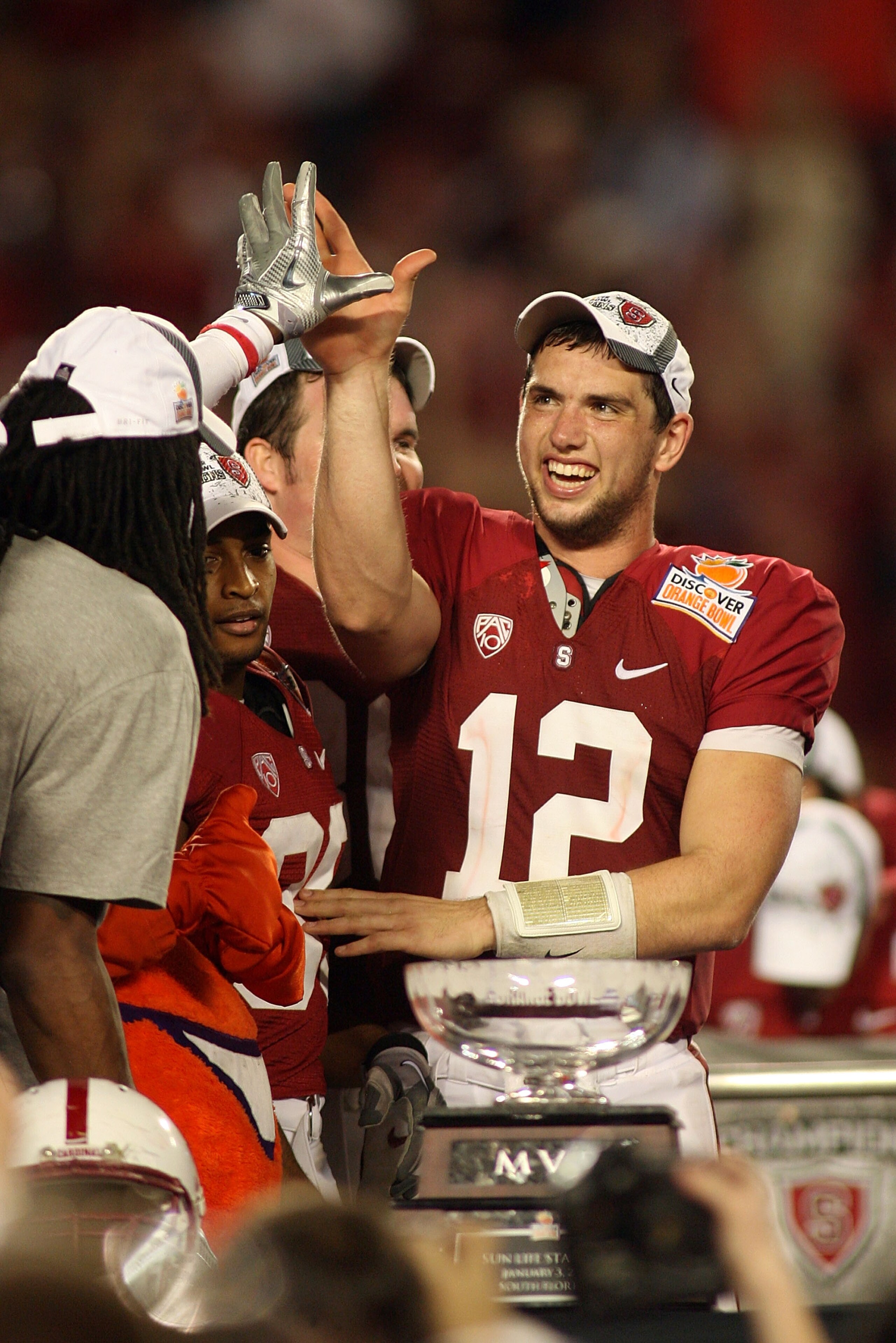 MIAMI, FL - JANUARY 03:  Orange Bowl MVP Andrew Luck #12 of the Stanford Cardinal celebrates with his teammates after STanford won 40-12 against the Virginai Tech Hokies during the 2011 Discover Orange Bowl at Sun Life Stadium on January 3, 2011 in Miami,