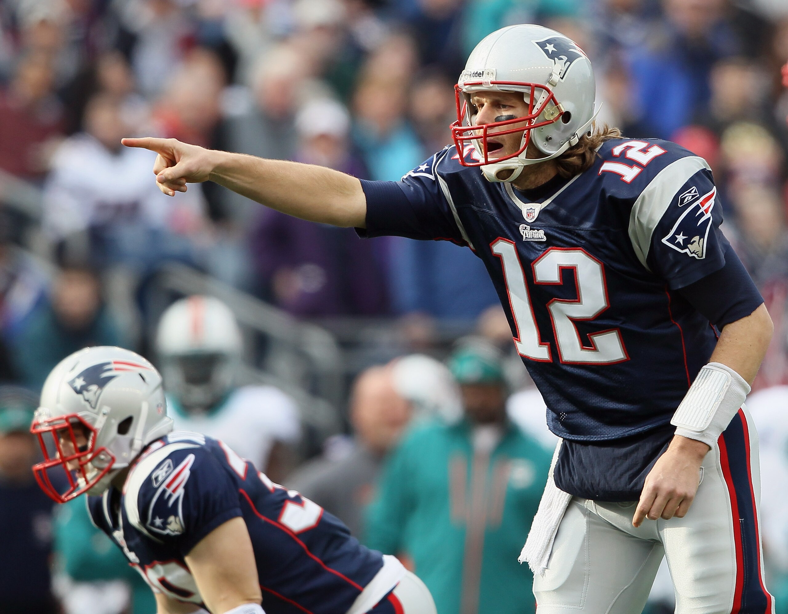 FOXBORO, MA - JANUARY 02:  Tom Brady #12 of the New England Patriots calls out the play in the first half against the Miami Dolphins on January 2, 2011 at Gillette Stadium in Foxboro, Massachusetts.  (Photo by Elsa/Getty Images)