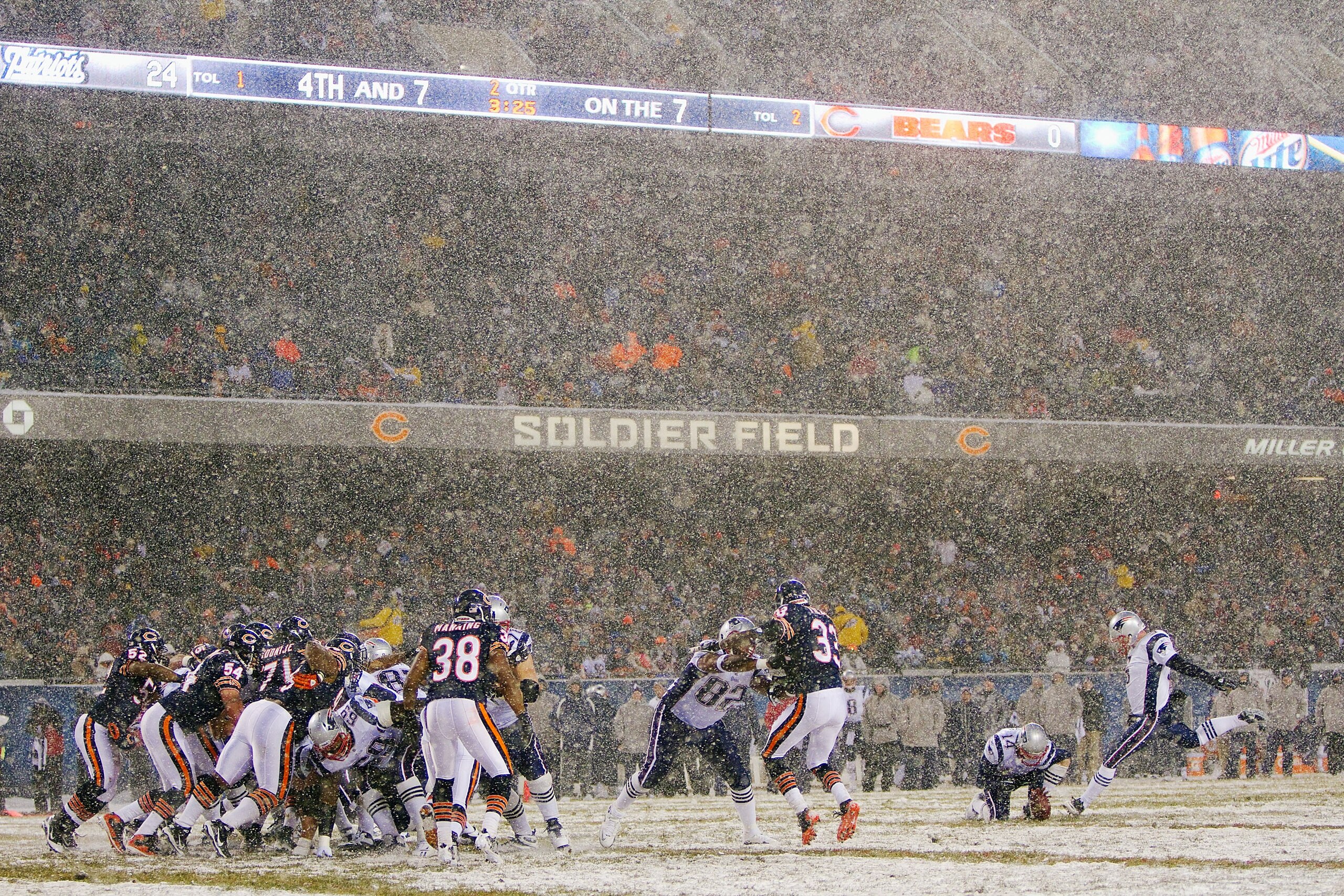 CHICAGO, IL - DECEMBER 12: Shayne Graham #5 of the New England Patriots kicks a field goal against the Chicago Bears at Soldier Field on December 12, 2010 in Chicago, Illinois.  The Patriots beat the Bears 36-7.  (Photo by Dilip Vishwanat/Getty Images)