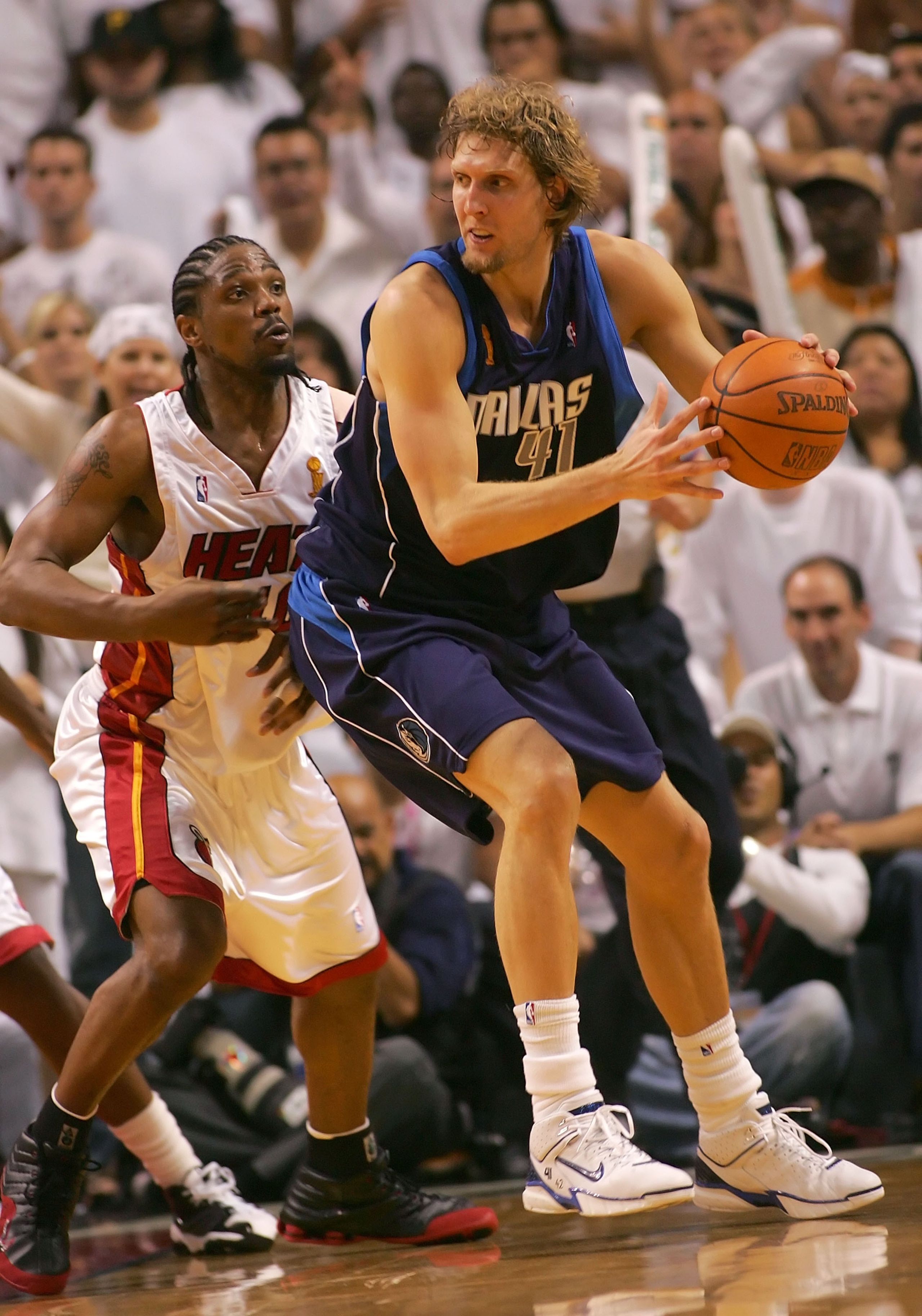MIAMI - JUNE 18: Dirk Nowitzki #41 of the Dallas Mavericks is guarded by Udonis Haslem #40 of the Miami Heat in game five of the 2006 NBA Finals on June 18, 2006 at American Airlines Arena in Miami, Florida. The Heat won in overtime 101-100. NOTE TO US MIAMI - JUNE 18: Dirk Nowitzki #41 of the Dallas Mavericks is guarded by Udonis Haslem #40 of the Miami Heat in game five of the 2006 NBA Finals on June 18, 2006 at American Airlines Arena in Miami, Florida. The Heat won in overtime 101-100. NOTE TO US