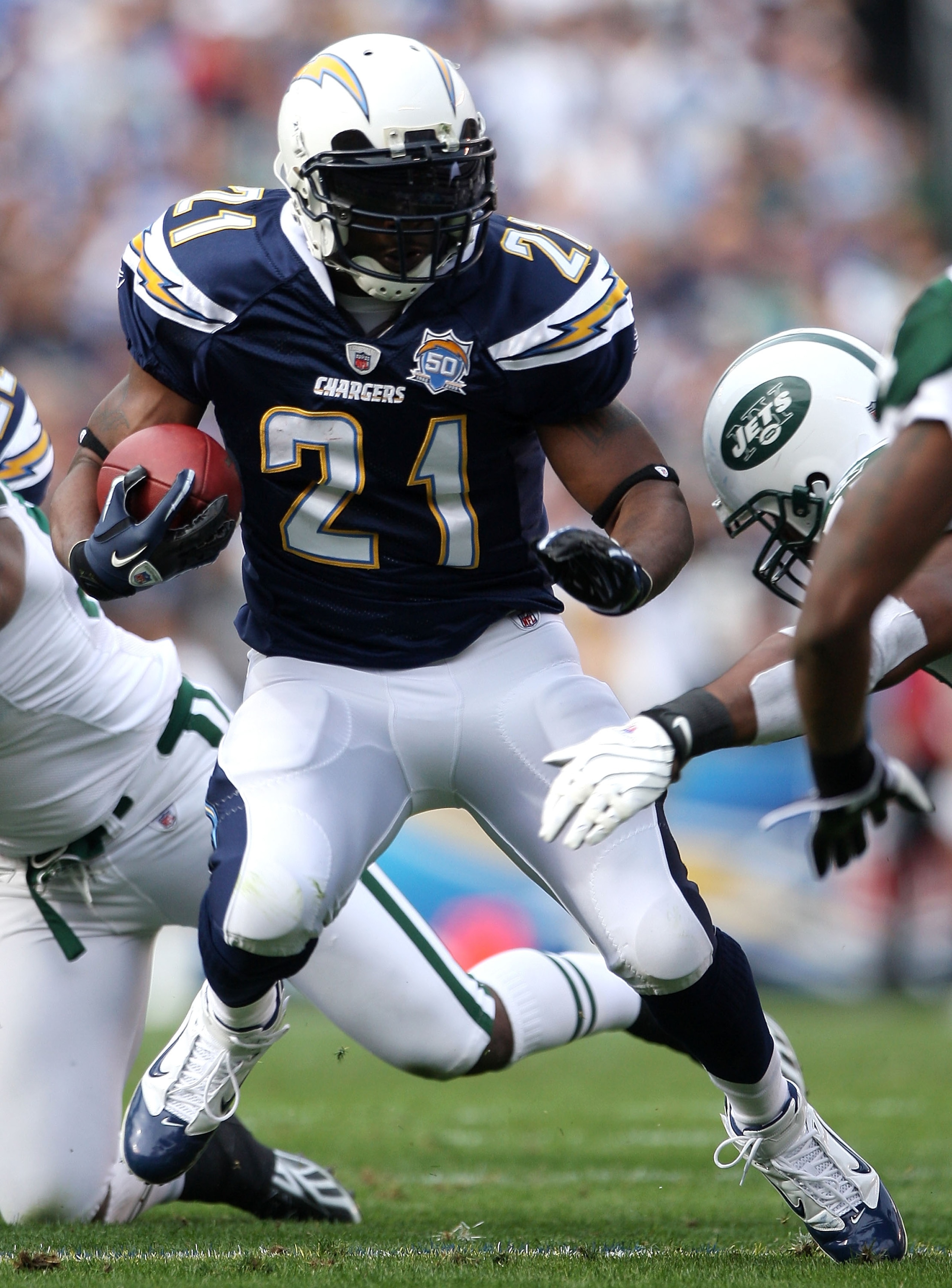 SAN DIEGO - JANUARY 17: Running back LaDainian Tomlinson #21 of the San Diego Chargers runs with the ball against the New York Jets during the AFC Divisional Playoff Game at Qualcomm Stadium on January 17, 2010 in San Diego, California. (Photo by Donald SAN DIEGO - JANUARY 17: Running back LaDainian Tomlinson #21 of the San Diego Chargers runs with the ball against the New York Jets during the AFC Divisional Playoff Game at Qualcomm Stadium on January 17, 2010 in San Diego, California. (Photo by Donald