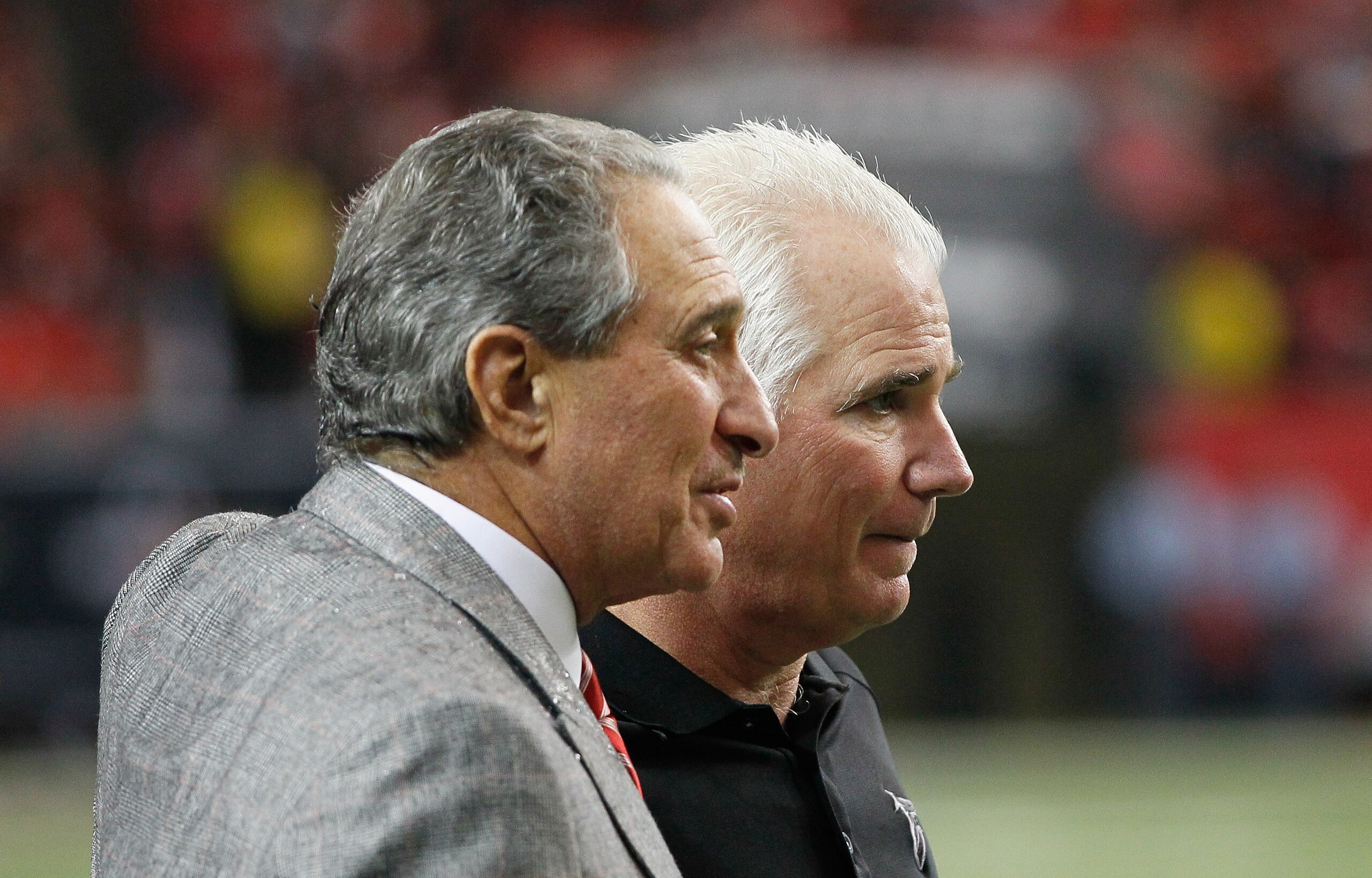 ATLANTA, GA - JANUARY 02:  Head coach Mike Smith and Owner and CEO Arthur Blank of the Atlanta Falcons celebrate in the final seconds of their 31-10 win over the Carolina Panthers at Georgia Dome on January 2, 2011 in Atlanta, Georgia.  (Photo by Kevin C.