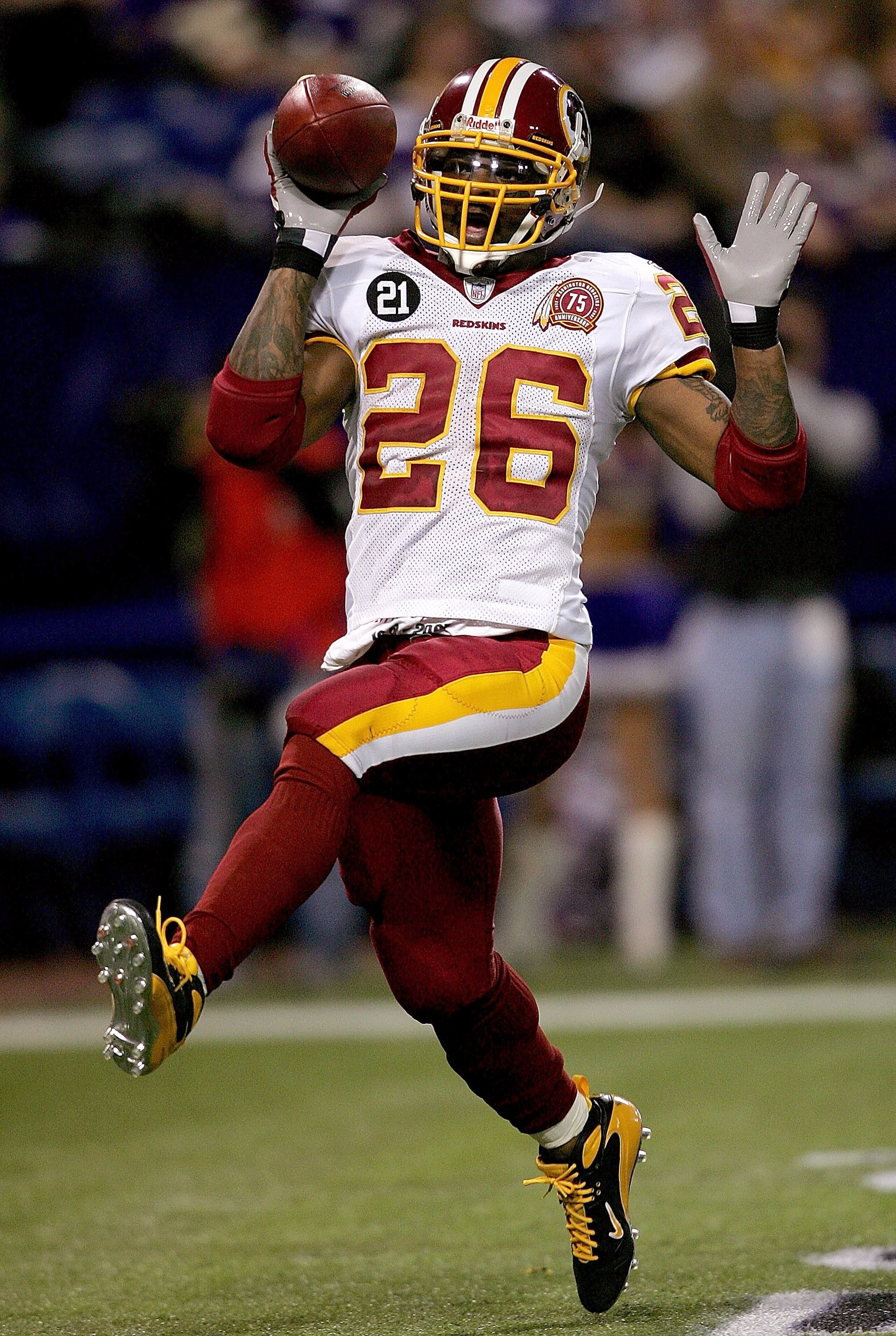 MINNEAPOLIS, MN - DECEMBER 23:  Clinton Portis #26 of the Washington Redskins celebrates in the endzone after scoring a touchdown against the Minnesota Vikings December 23, 2007 at the H.H.H. Metrodome in Minneapolis, Minnesota  (Photo by Matthew Stockman