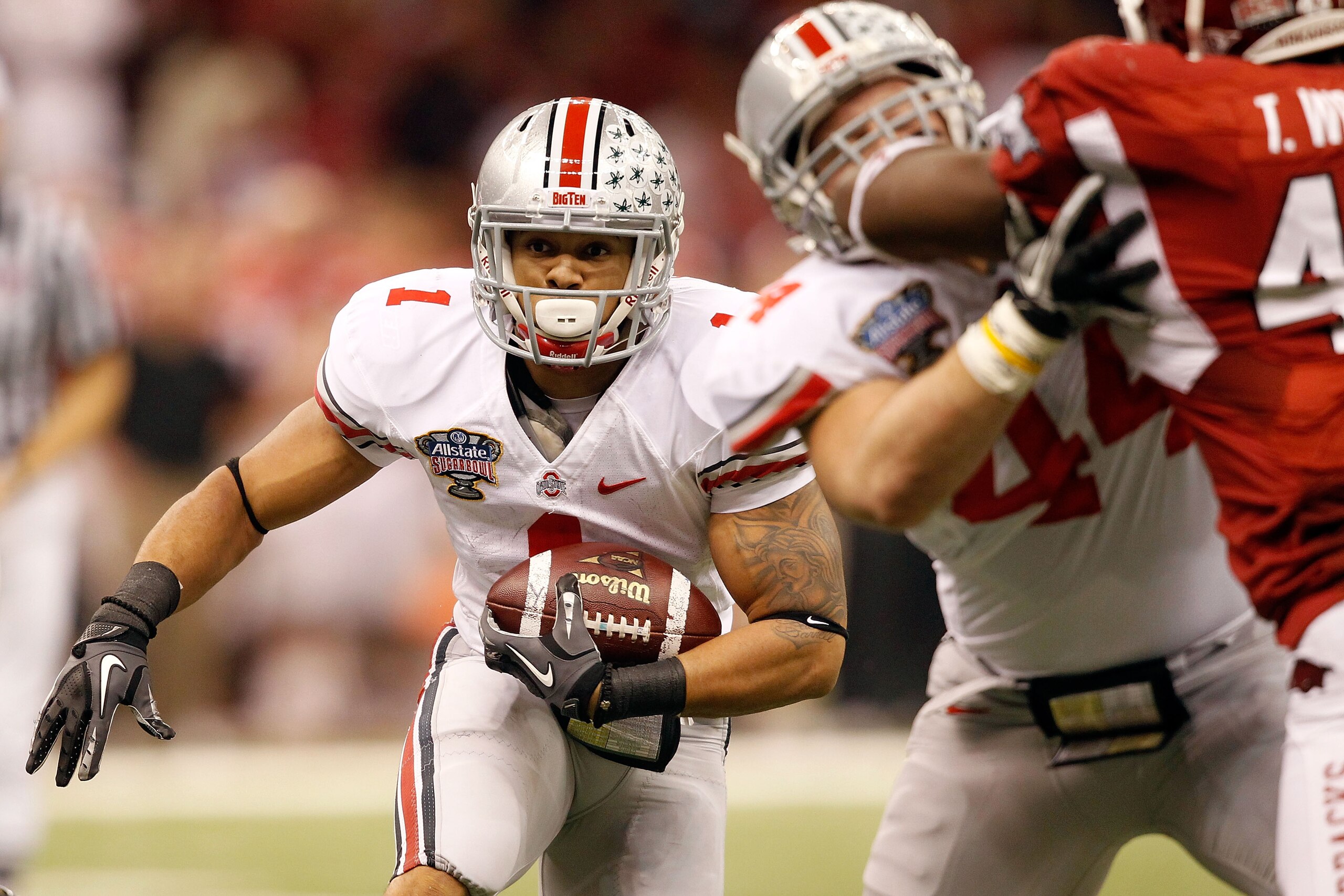 NEW ORLEANS, LA - JANUARY 04: Dan Herron #1 of the Ohio State Buckeyes runs the ball in the first half against the Arkansas Razorbacks during the Allstate Sugar Bowl at the Louisiana Superdome on January 4, 2011 in New Orleans, Louisiana. (Photo by Matt NEW ORLEANS, LA - JANUARY 04: Dan Herron #1 of the Ohio State Buckeyes runs the ball in the first half against the Arkansas Razorbacks during the Allstate Sugar Bowl at the Louisiana Superdome on January 4, 2011 in New Orleans, Louisiana. (Photo by Matt