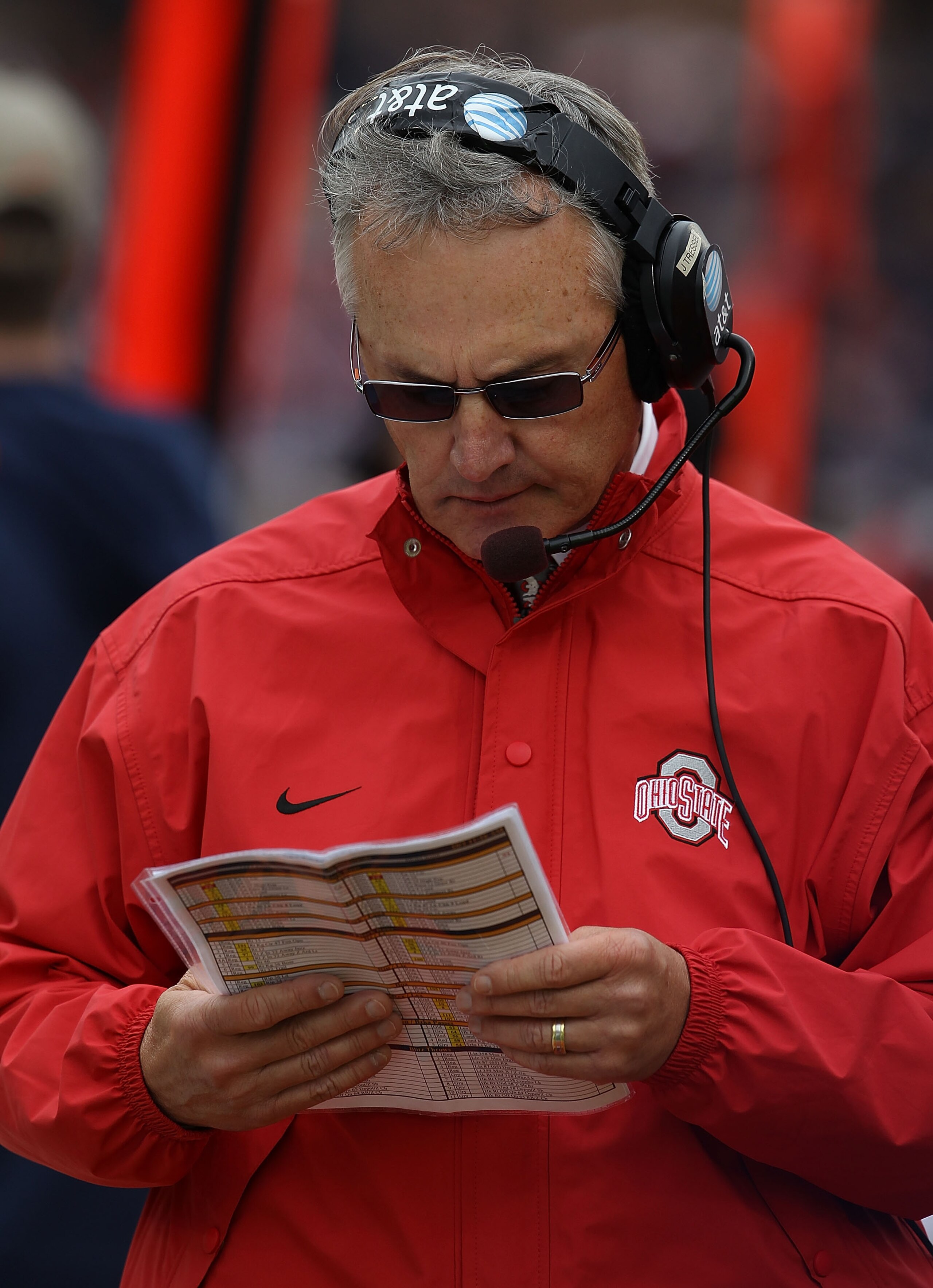 CHAMPAIGN, IL - OCTOBER 02: Head coach Jim Tressell of the Ohio State Buckeyes checks his play list during a game against the Illinois Fighting Illini at Memorial Stadium on October 2, 2010 in Champaign, Illinois. Ohio State defeated Illinois 24-13. (Phot CHAMPAIGN, IL - OCTOBER 02: Head coach Jim Tressell of the Ohio State Buckeyes checks his play list during a game against the Illinois Fighting Illini at Memorial Stadium on October 2, 2010 in Champaign, Illinois. Ohio State defeated Illinois 24-13. (Phot