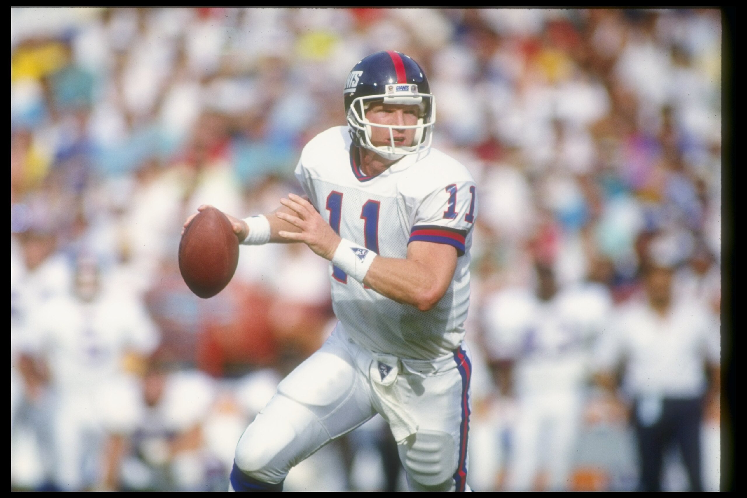 11 Nov 1990: Quarterback Phil Simms of the New York Giants looks to pass the ball during a game against the Los Angeles Rams at Anaheim Stadium in Anaheim, California. The Giants won the game, 31-7. Mandatory Credit: Mike Powell /Allsport 11 Nov 1990: Quarterback Phil Simms of the New York Giants looks to pass the ball during a game against the Los Angeles Rams at Anaheim Stadium in Anaheim, California. The Giants won the game, 31-7. Mandatory Credit: Mike Powell /Allsport